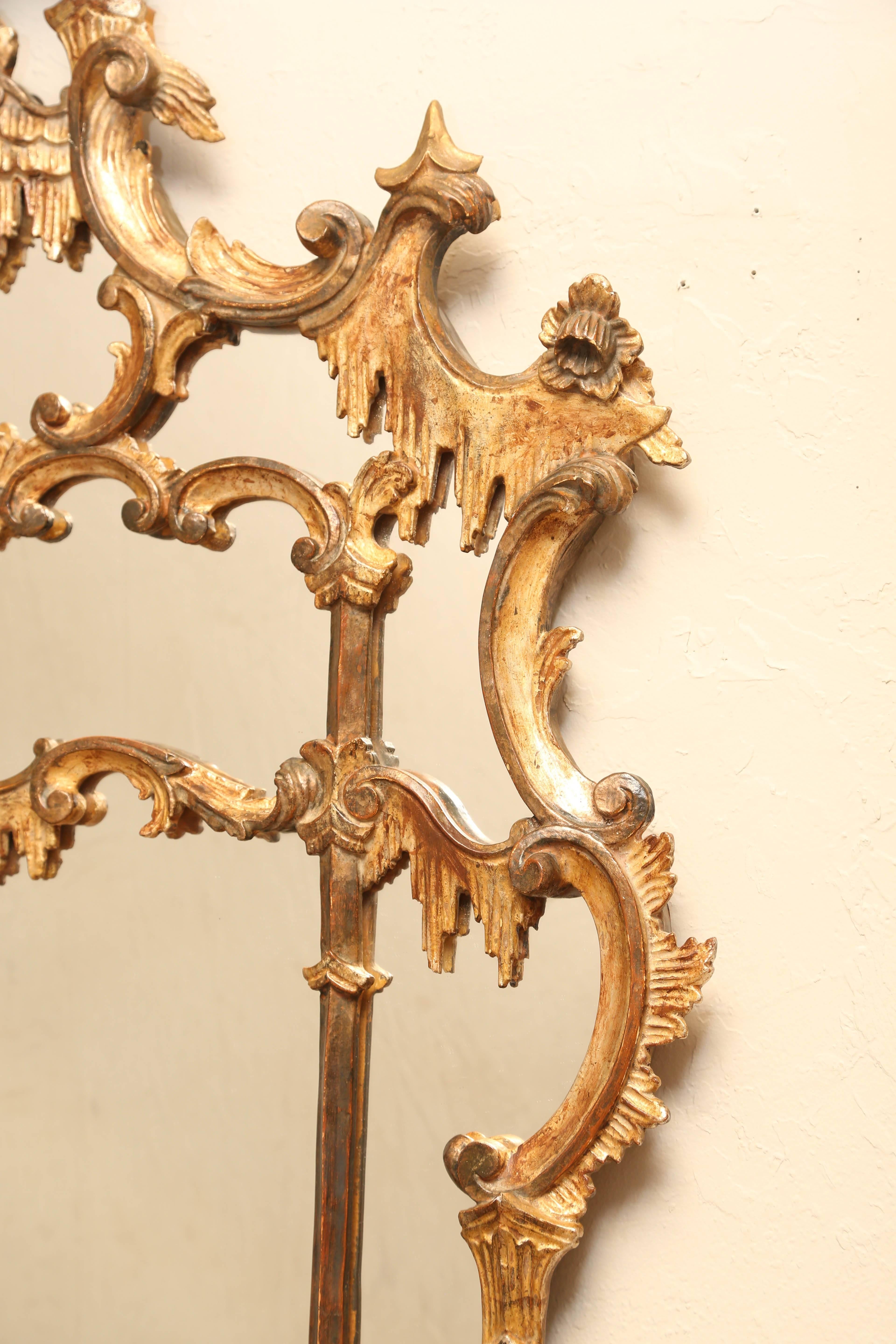 Beautiful hand-carved and gilded chinoiserie mirror in the pogoda style.