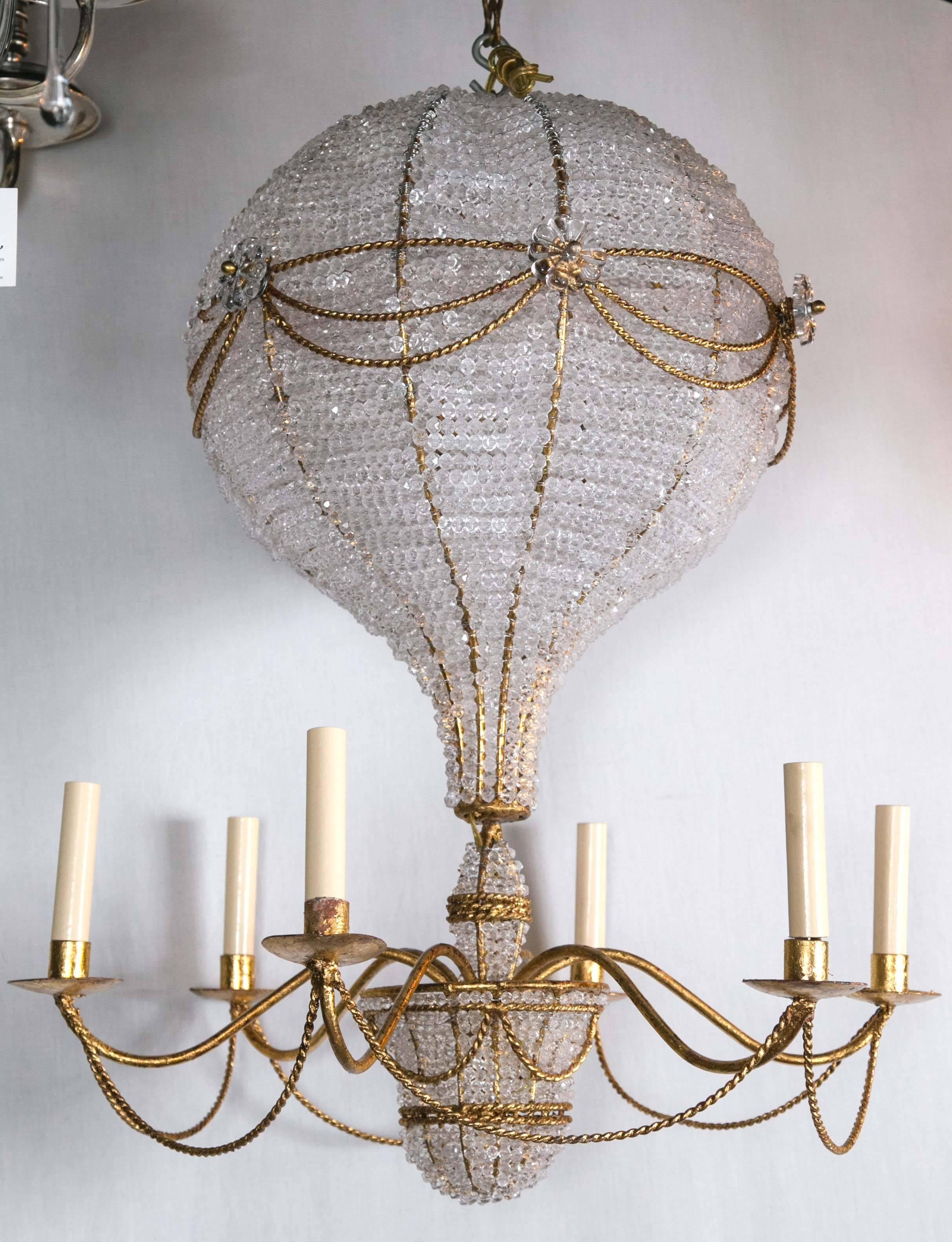 A circa 1930s glt and beaded crystal six-light chandelier.