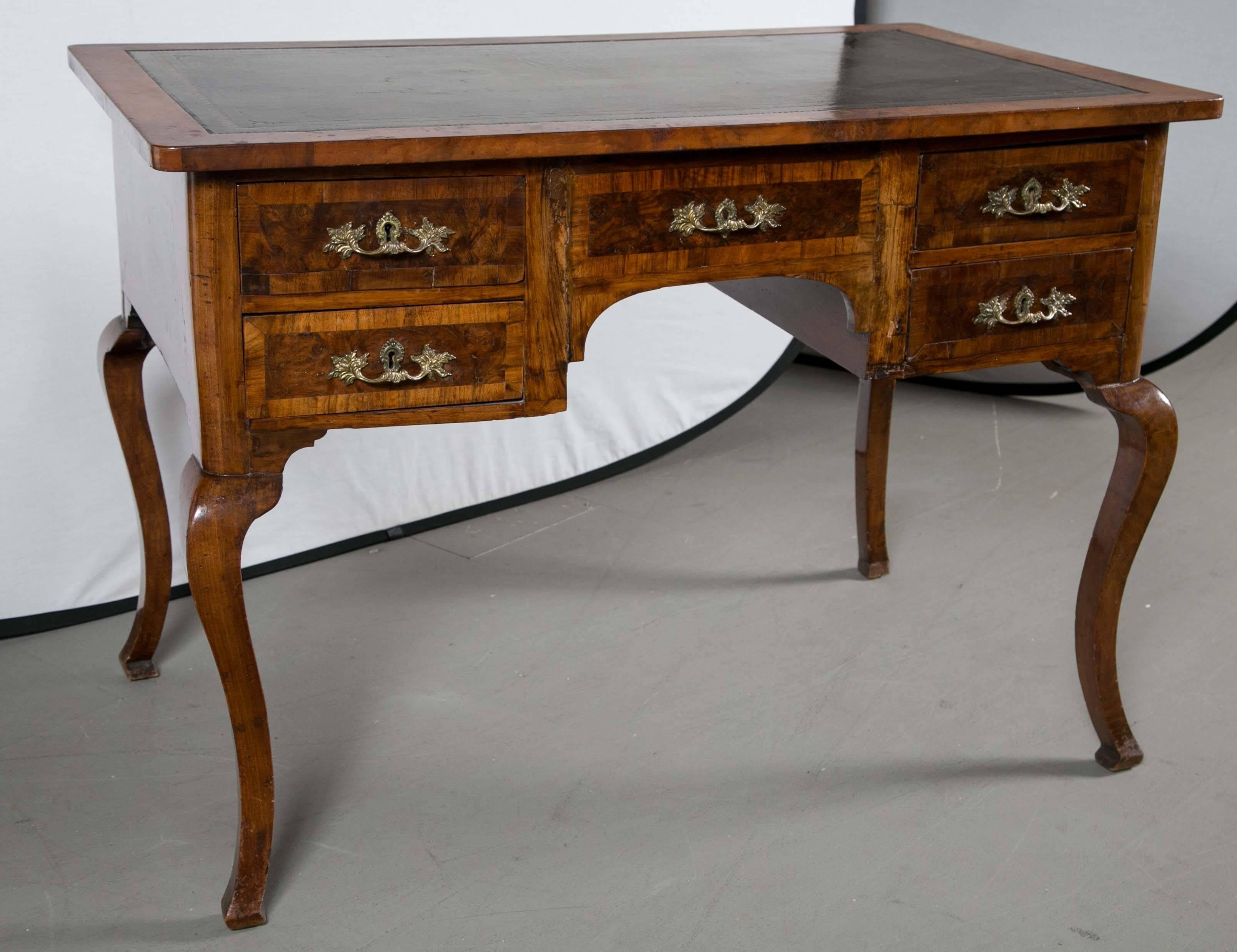 Double sided antique French desk with tooled leather top surface.