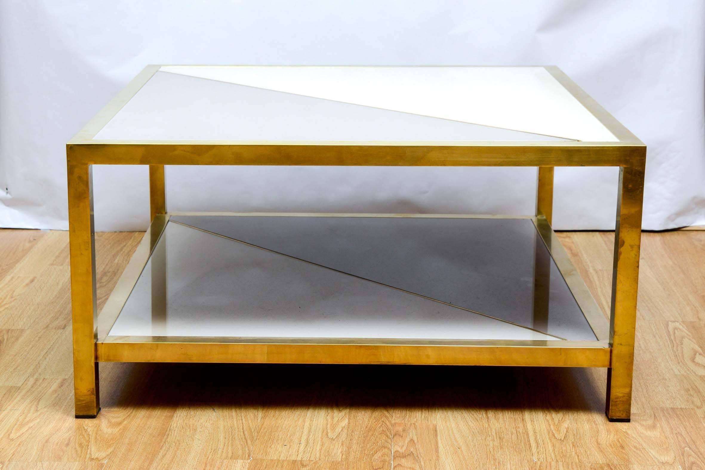 Coffee table with tinted glass and brass.