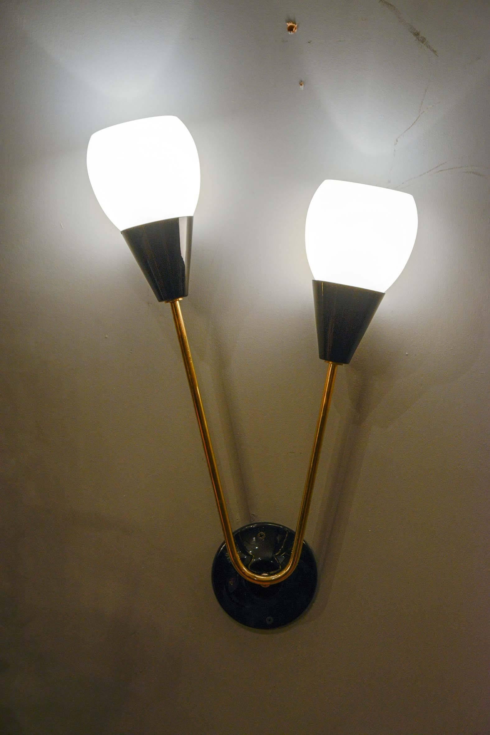 Set of four sconces with two lights per sconce, black metal, brass and white globe.