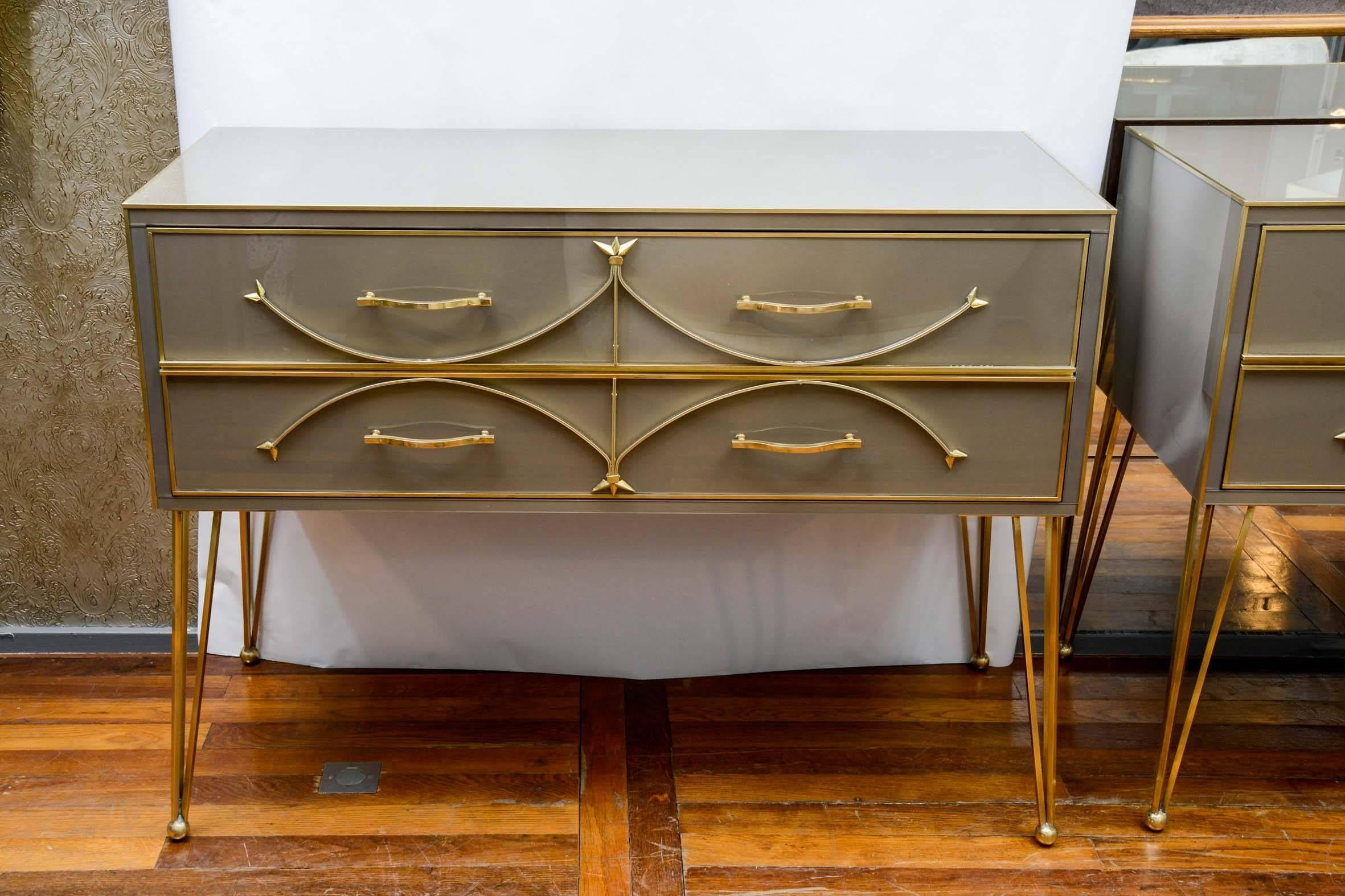 Pair of large commodes with two drawers, brass fillet, brass legs, taupe color mirror.