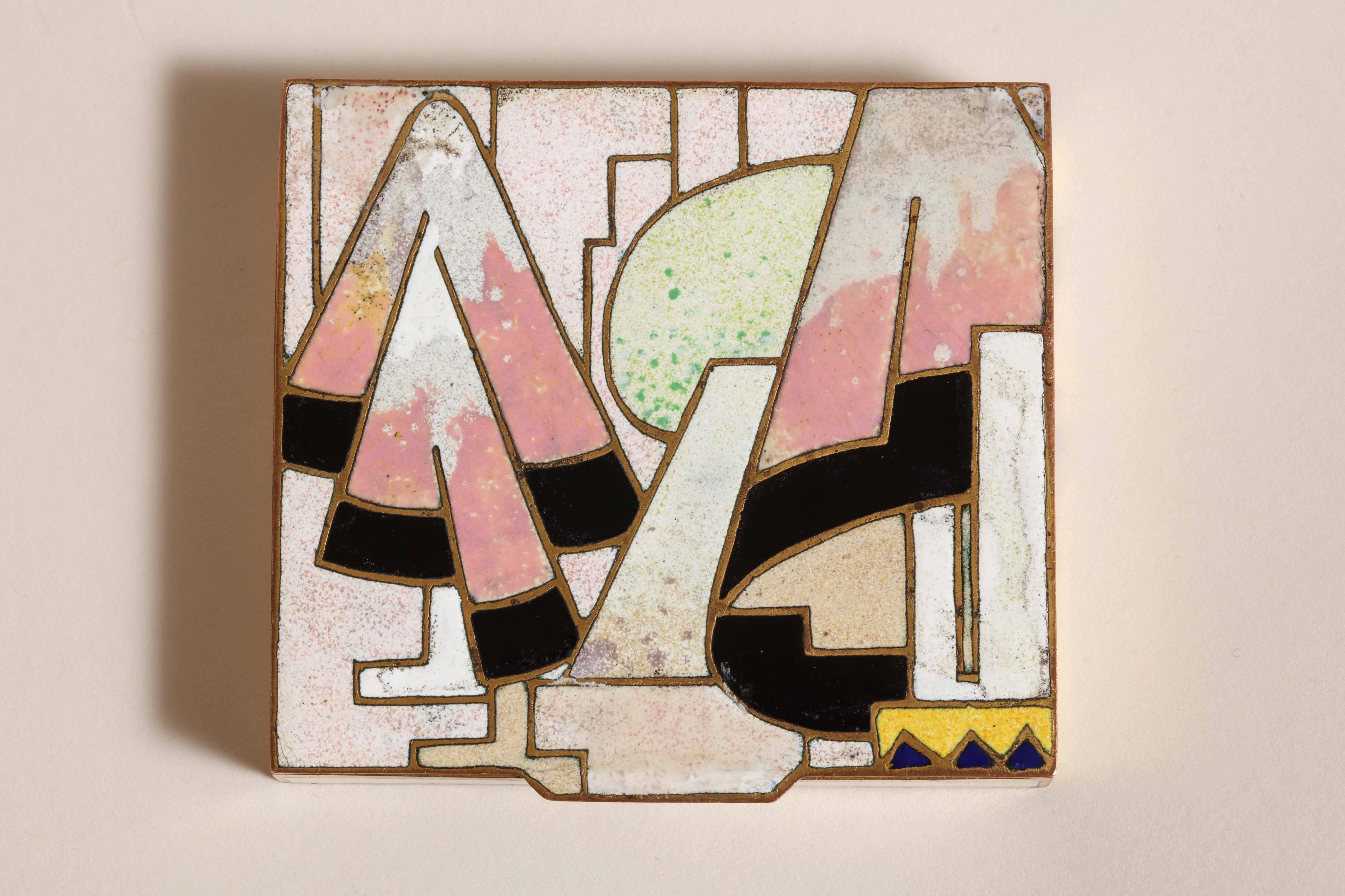This rectangular box has white, black, pink, yellow and light green champlevé enamel design on top and white enamel on the sides. 
Inscribed: Jean Goulden XXXIII 1926 underneat. 

Literature:
Bernard Goulden, 