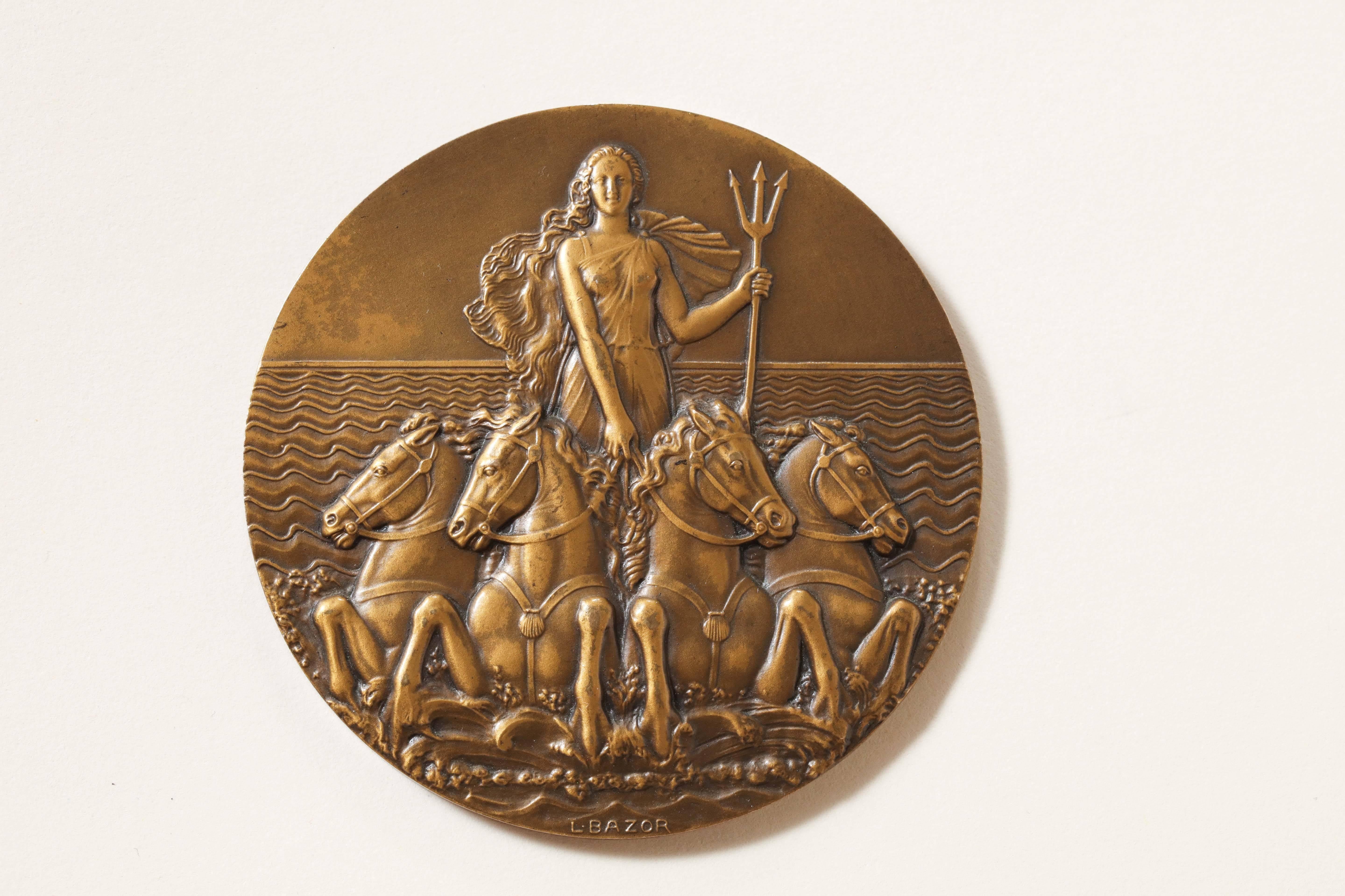 French Art Deco bronze medal commemorating the SS L'ATLANTIQUE, 1931.
This is one of the rarest of the ship medals.
By Lucien Bazor who was the Chief Engraver at the Paris mint from 1930-1958.

Obverse: Venus holding a trident and riding a four
