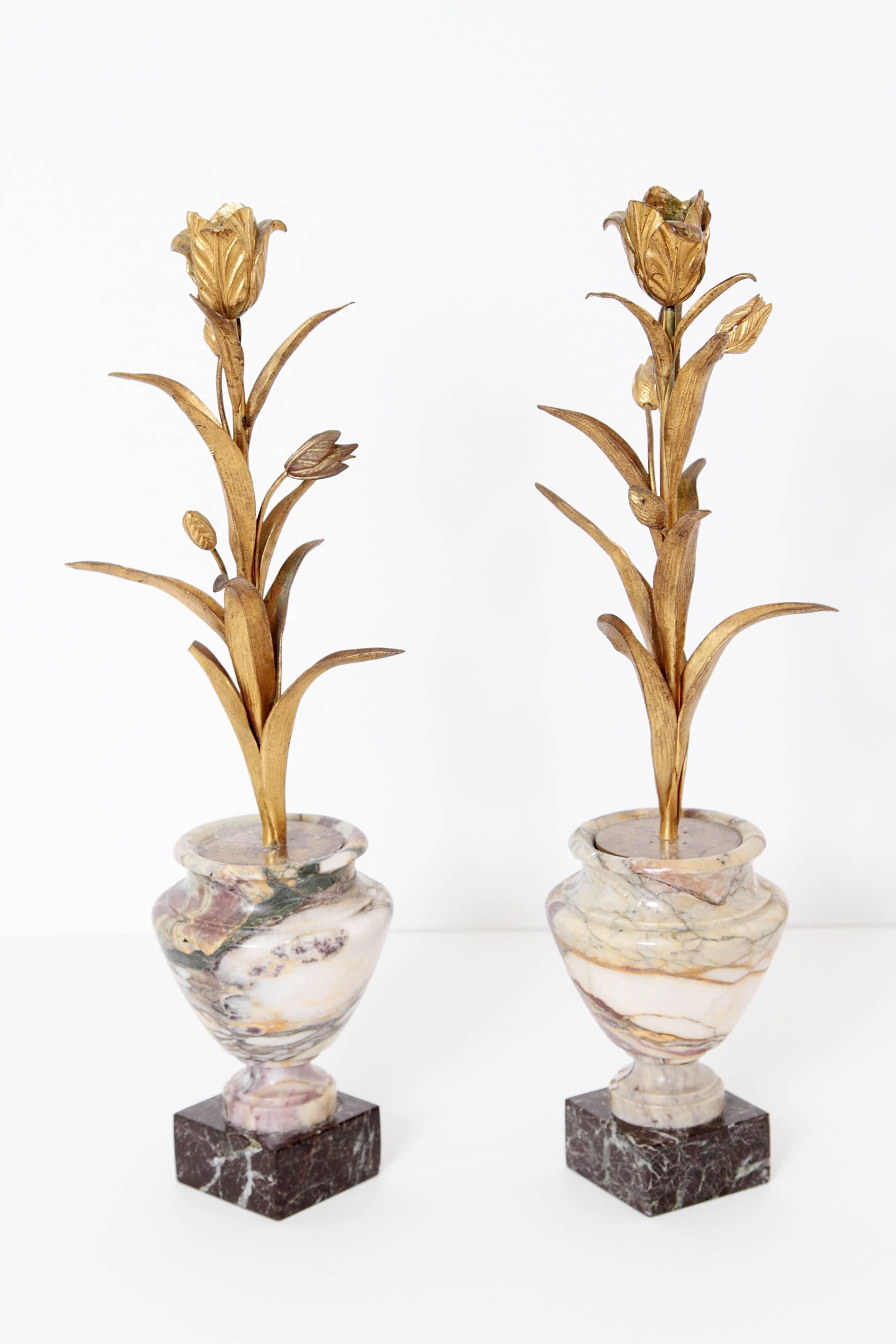 Stunning pair of 19th century gilt bronze tulip shaped candleholders. Set in marble urns, upon square marble bases. So Beautiful!

 