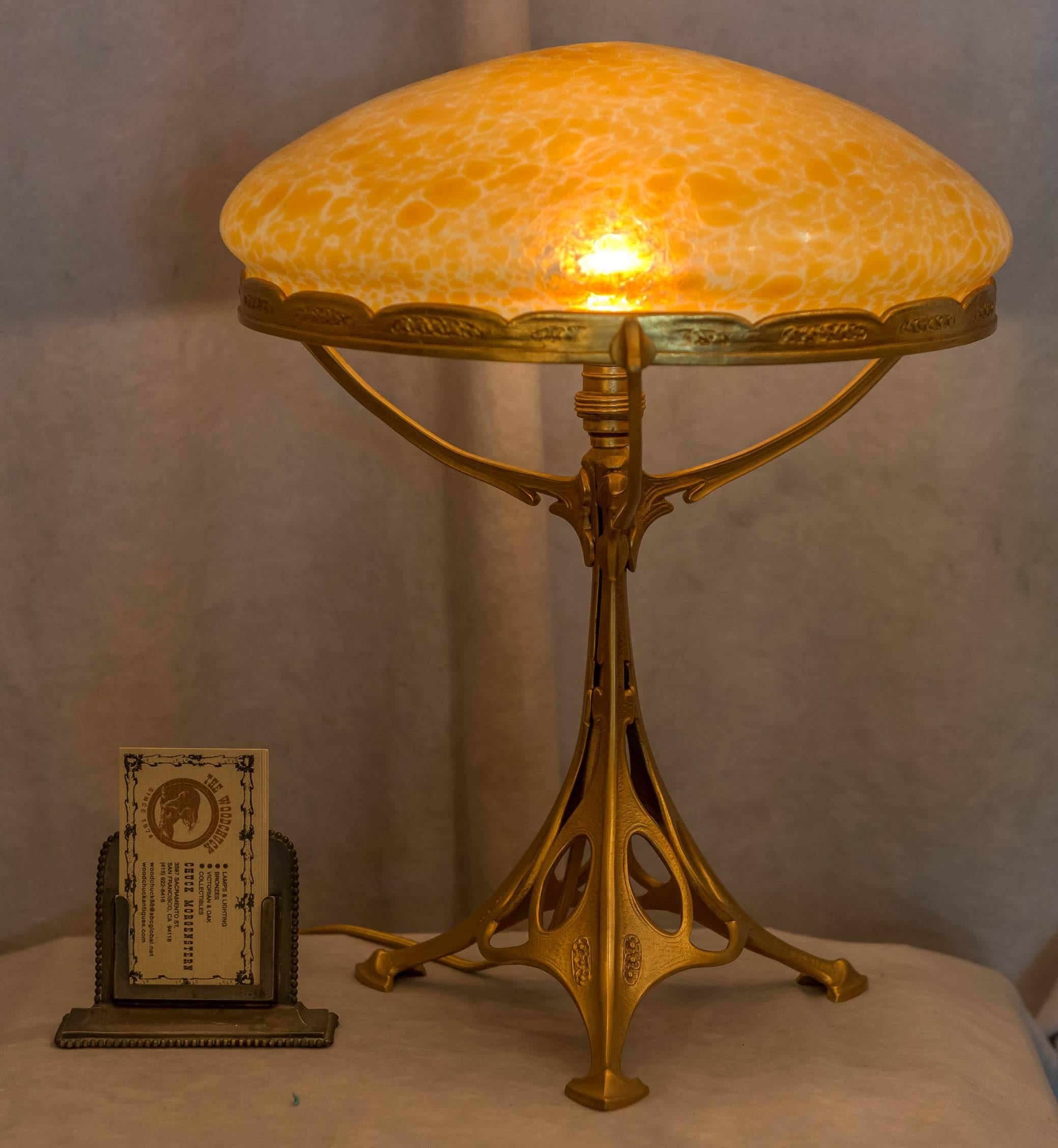 If you peruse our lamp inventory you will see we have a special love of Austrian lighting. We find their design to be very aesthetic, and their glass to be exceptional. Here we have a fine example of exactly that. Gilt bronze, and what we call an