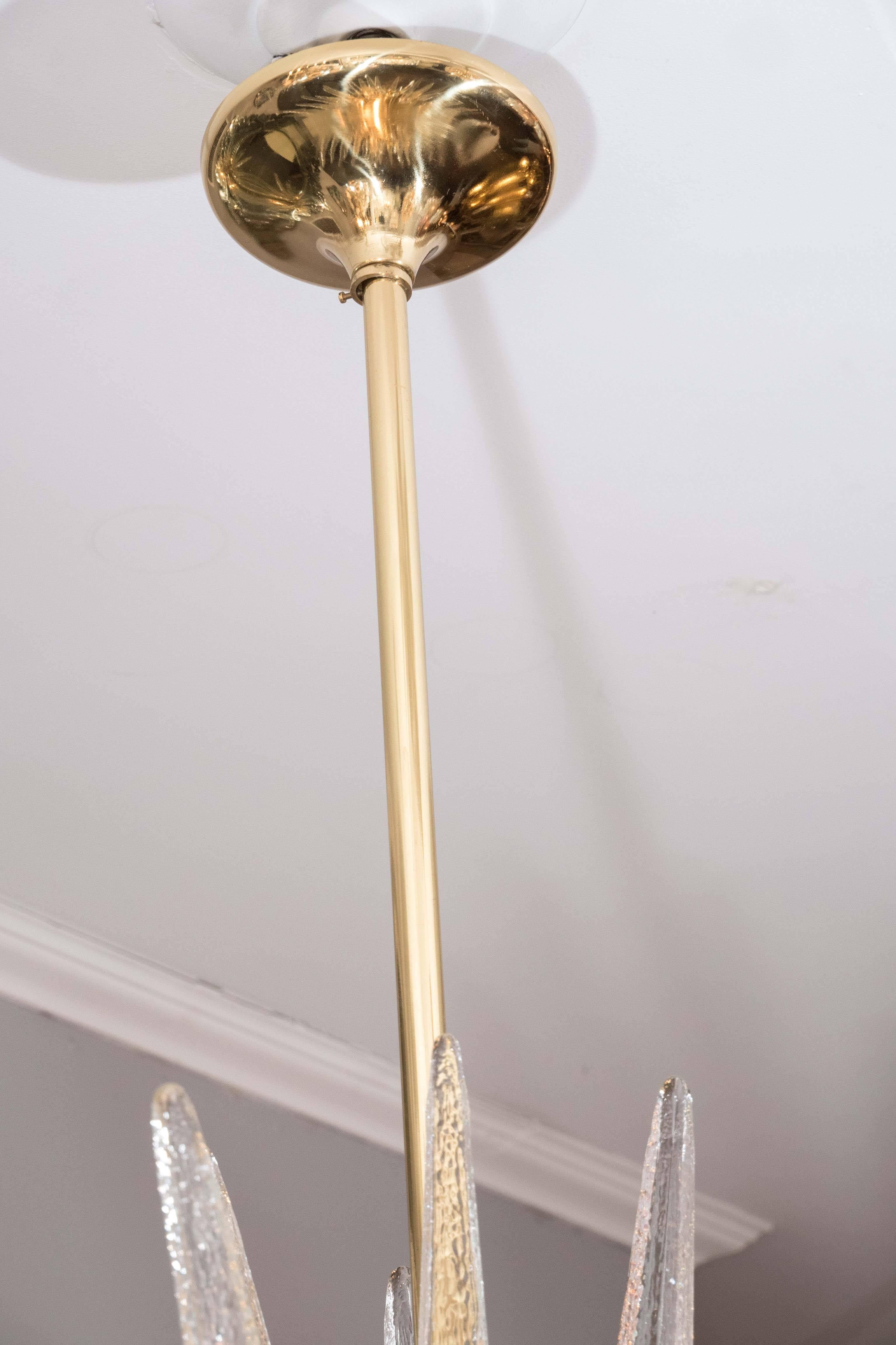 Clear Murano glass spike Sputnik with interior brass spheres. Customization available in different sizes, and finishes.