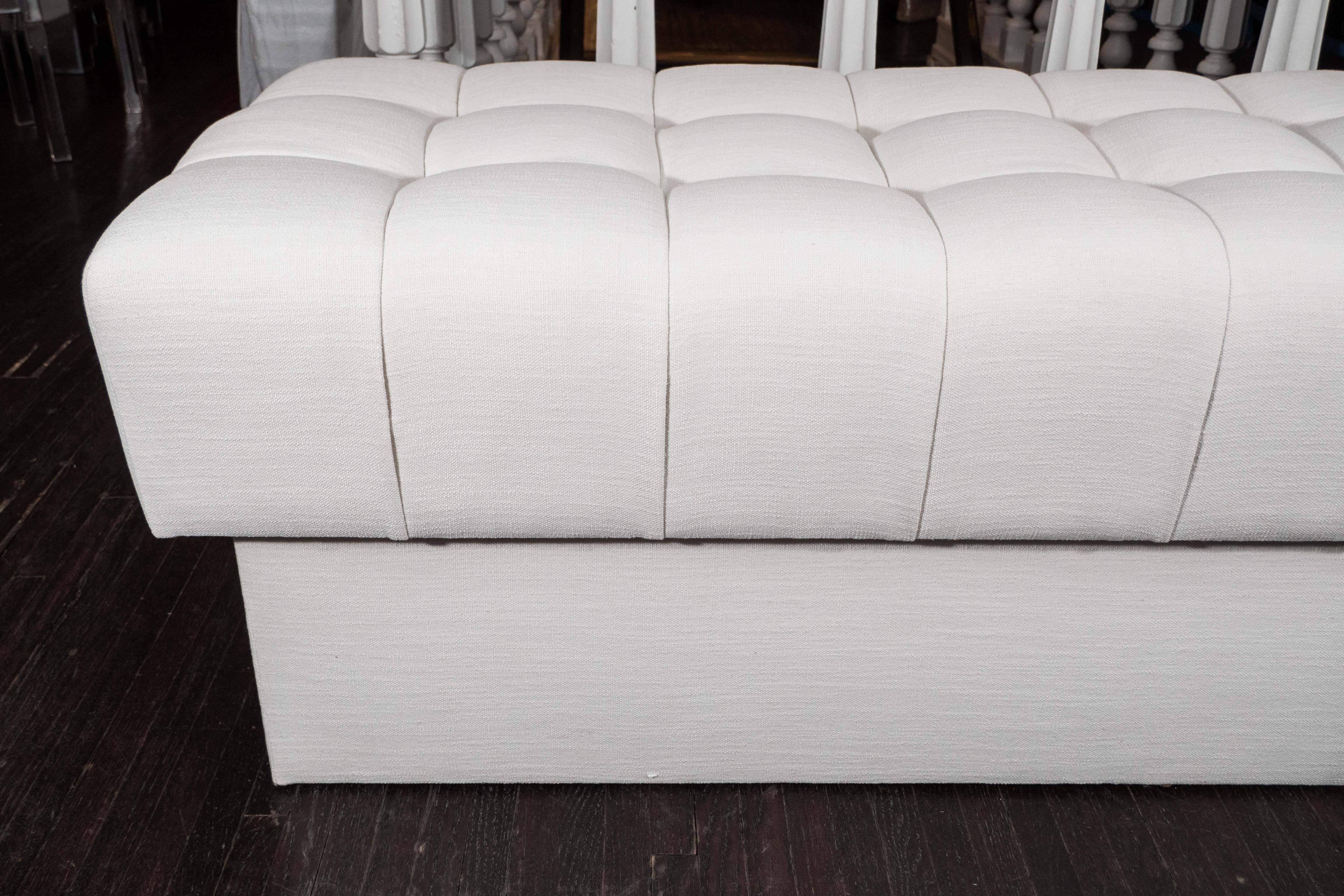 Fully upholstered tufted bench. 
COM (4 yards).