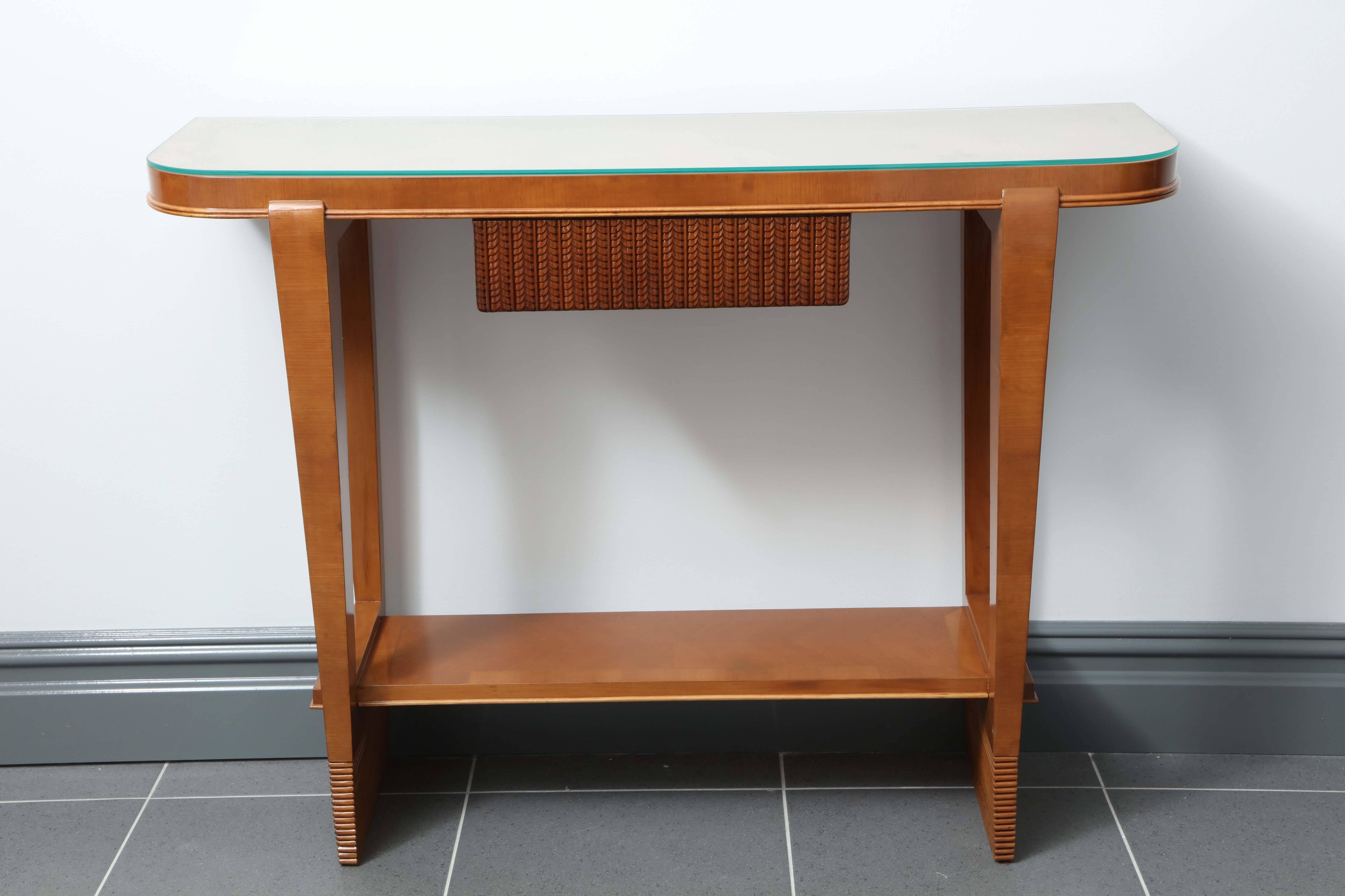 Stunning console designed by Osvaldo Borsani, made in 1936 in Milan by Atelier Borsani Varedo. 
Walnut with a centre drawer with a carved design of fern leaves, legs of console's has a channeled design, top in glass.
Great quality.