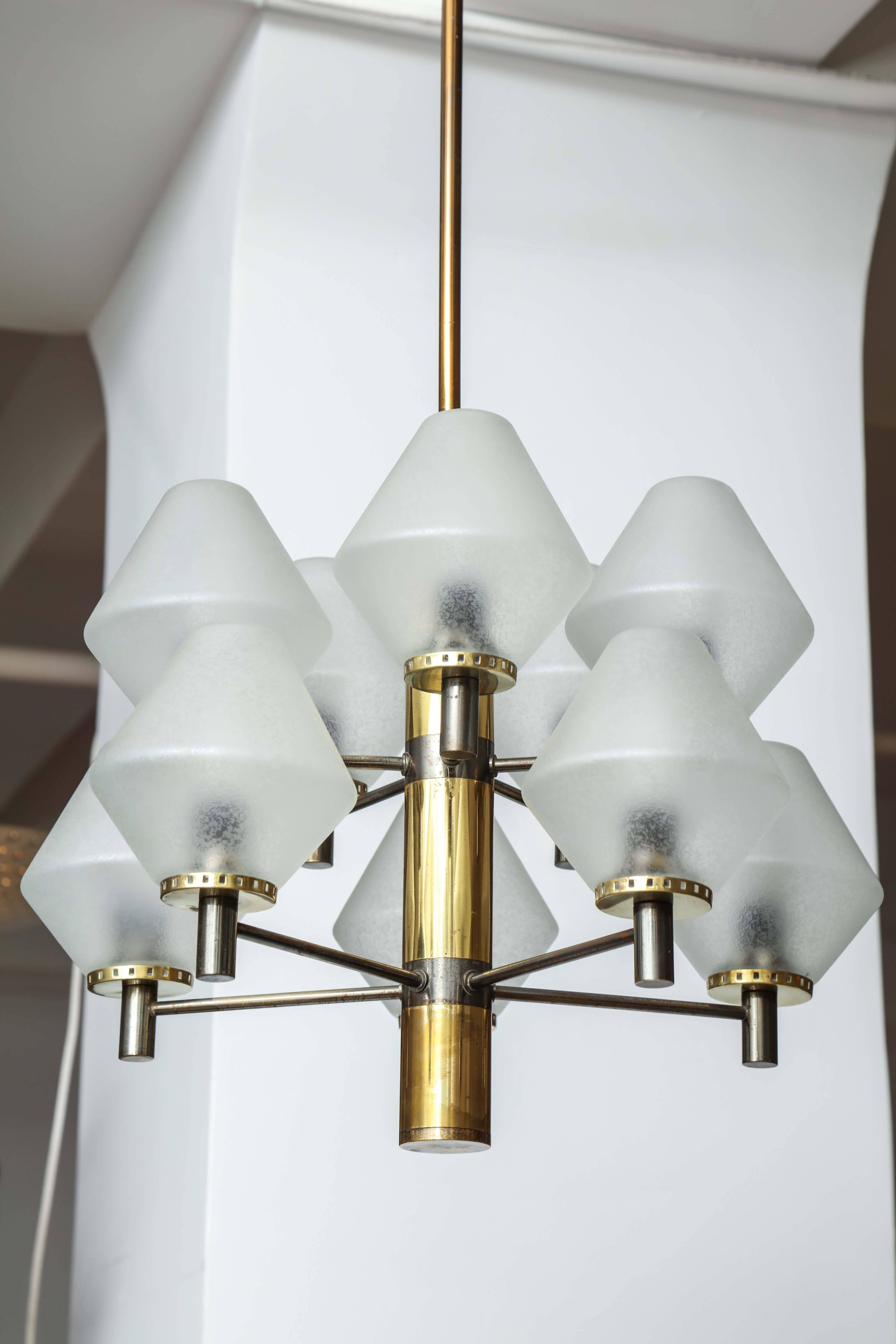 Modernist Stilnovo chandelier made in Milan, 1970, ten acid etched blown glass shades on a brass and oxidized frame, striking form,takes ten e14 bulbs.
 