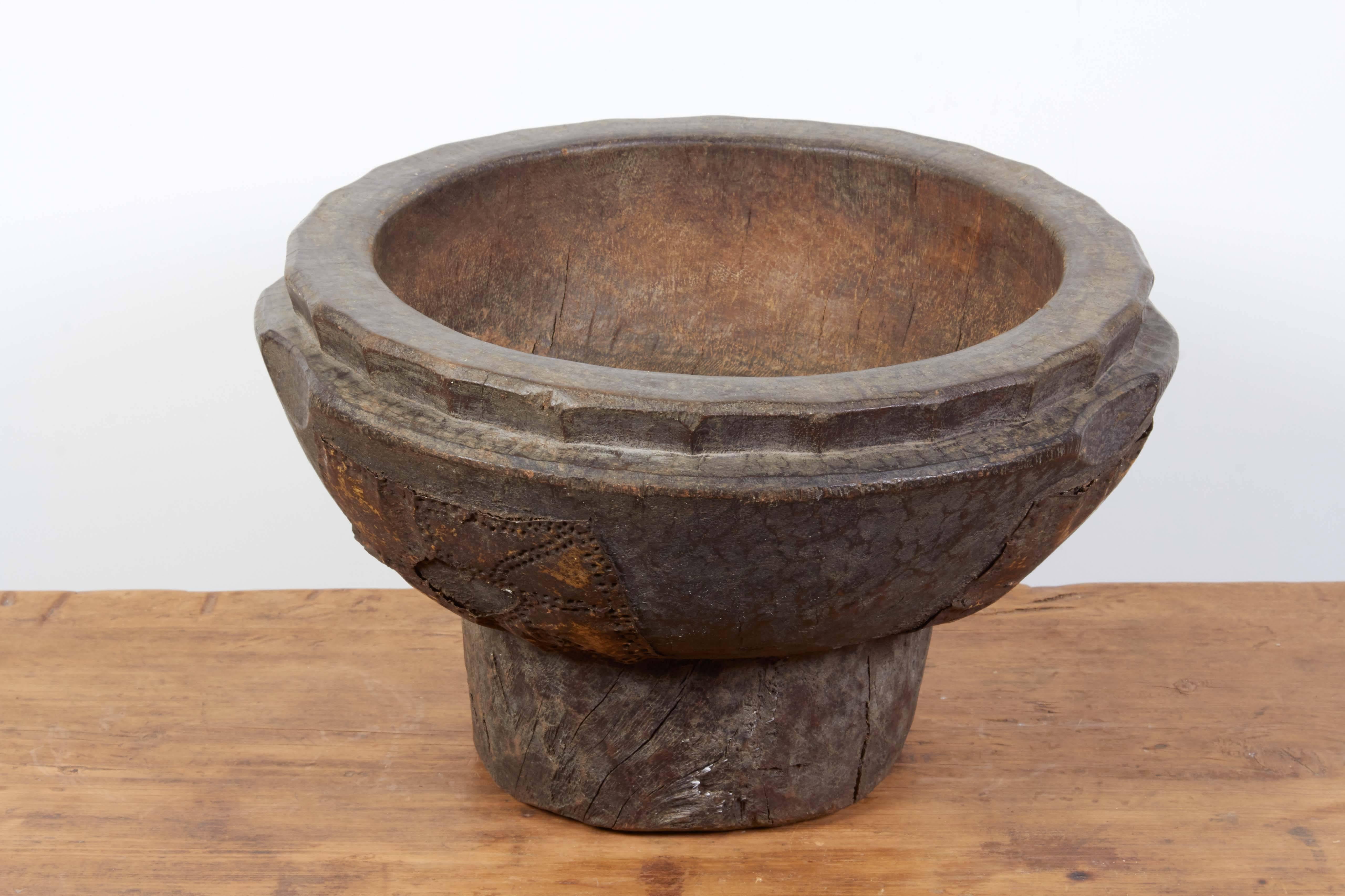 A heavy, thick walled antique West African bowl carved from a single piece of wood with great metal decorations. Subtle and attractive patina. This piece has great presence and would make a beautiful centerpiece.
BT396.
