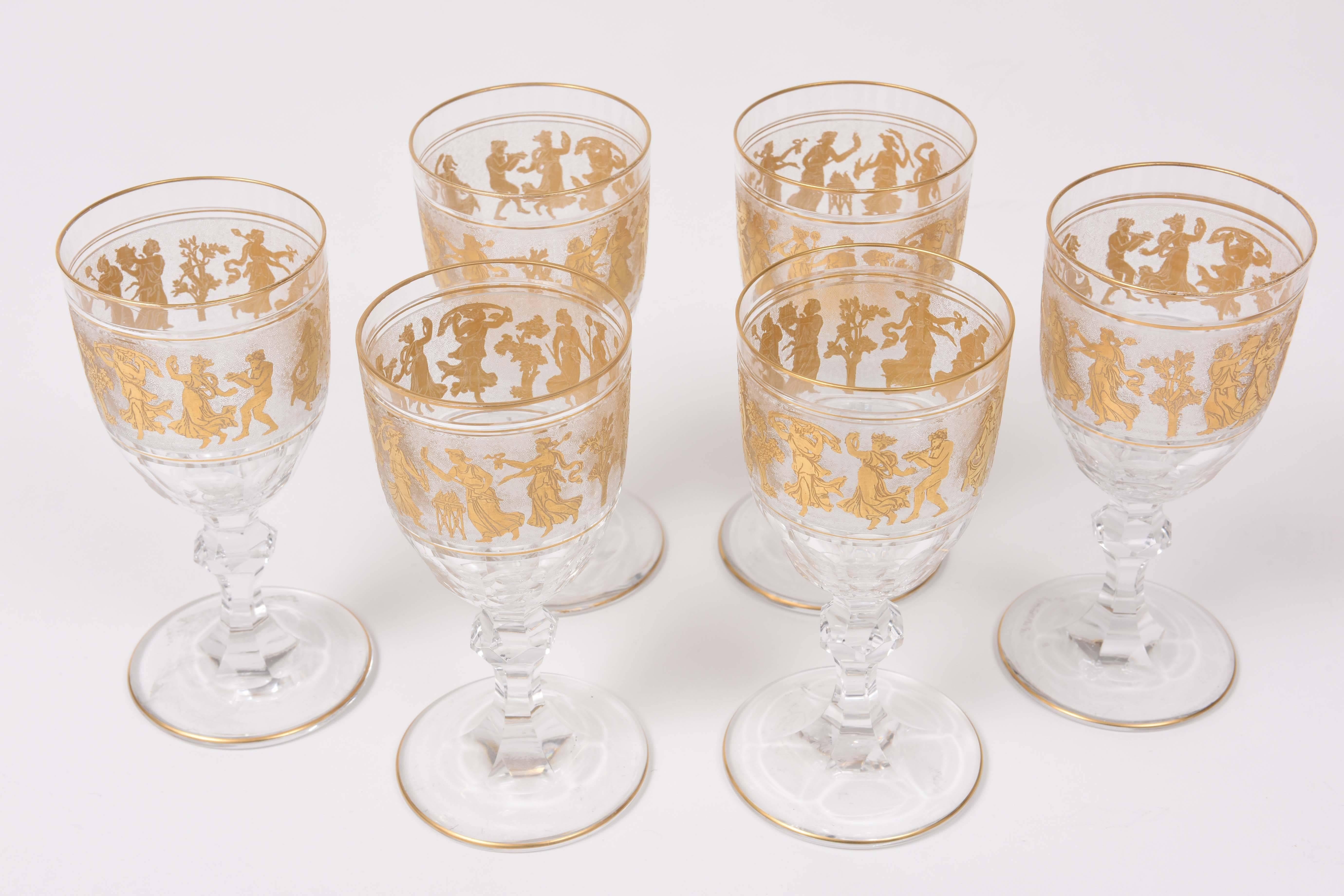 One of this storied firms Classic and beloved patterns, known affectionately as Danse. A heavy blown cut glass goblet with dancing figures surround on an acid etched background. Trimmed on top and base with 24-karat gold with a nicely proportioned