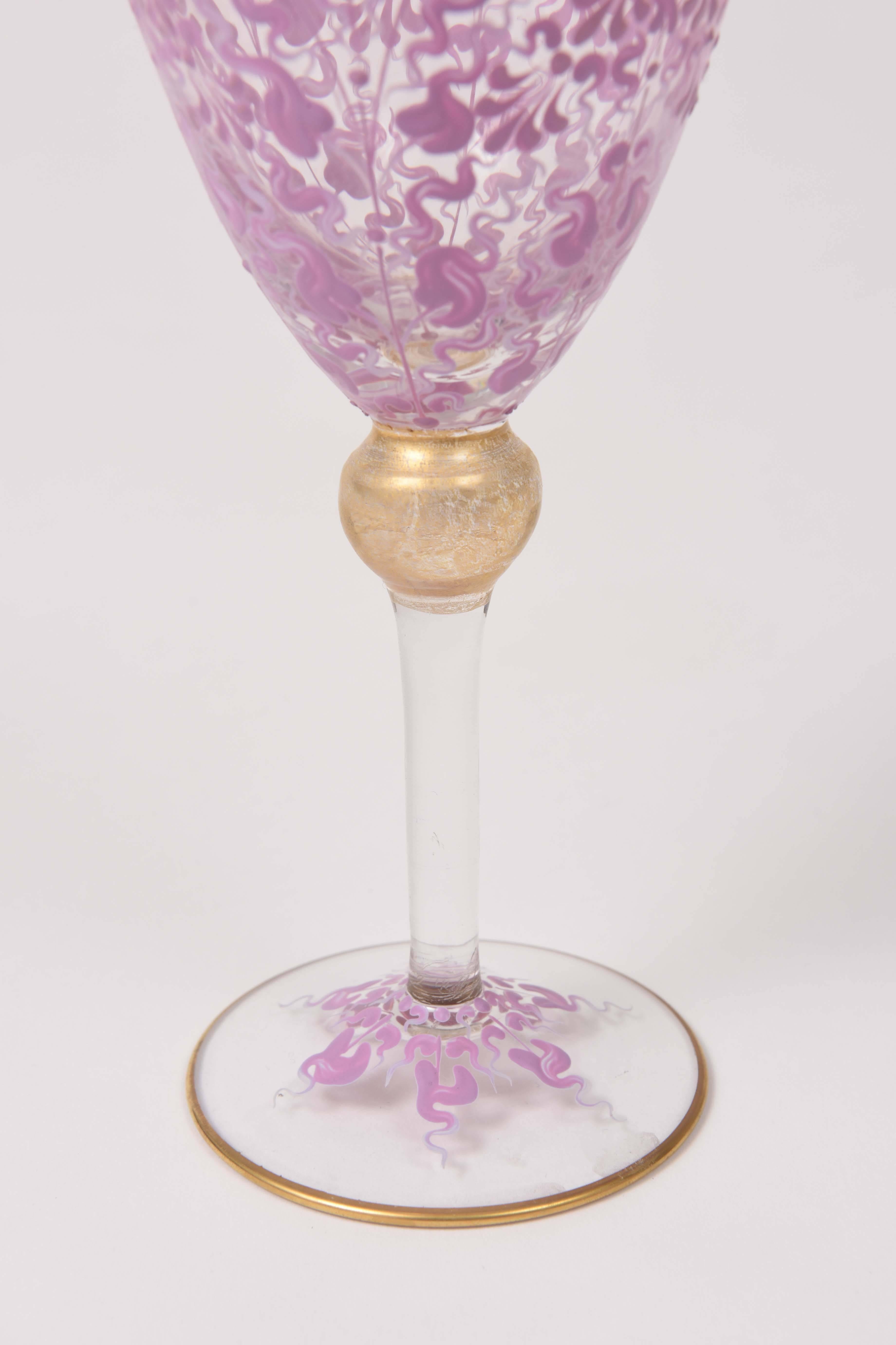 An exquisite set of Venetian glass that has been beautifully blown and features a double color pink hand enamel pattern on its bowl and stem. A nice gilded knob stem makes them a delight to hold and they have great balance. Trimmed on the rim and