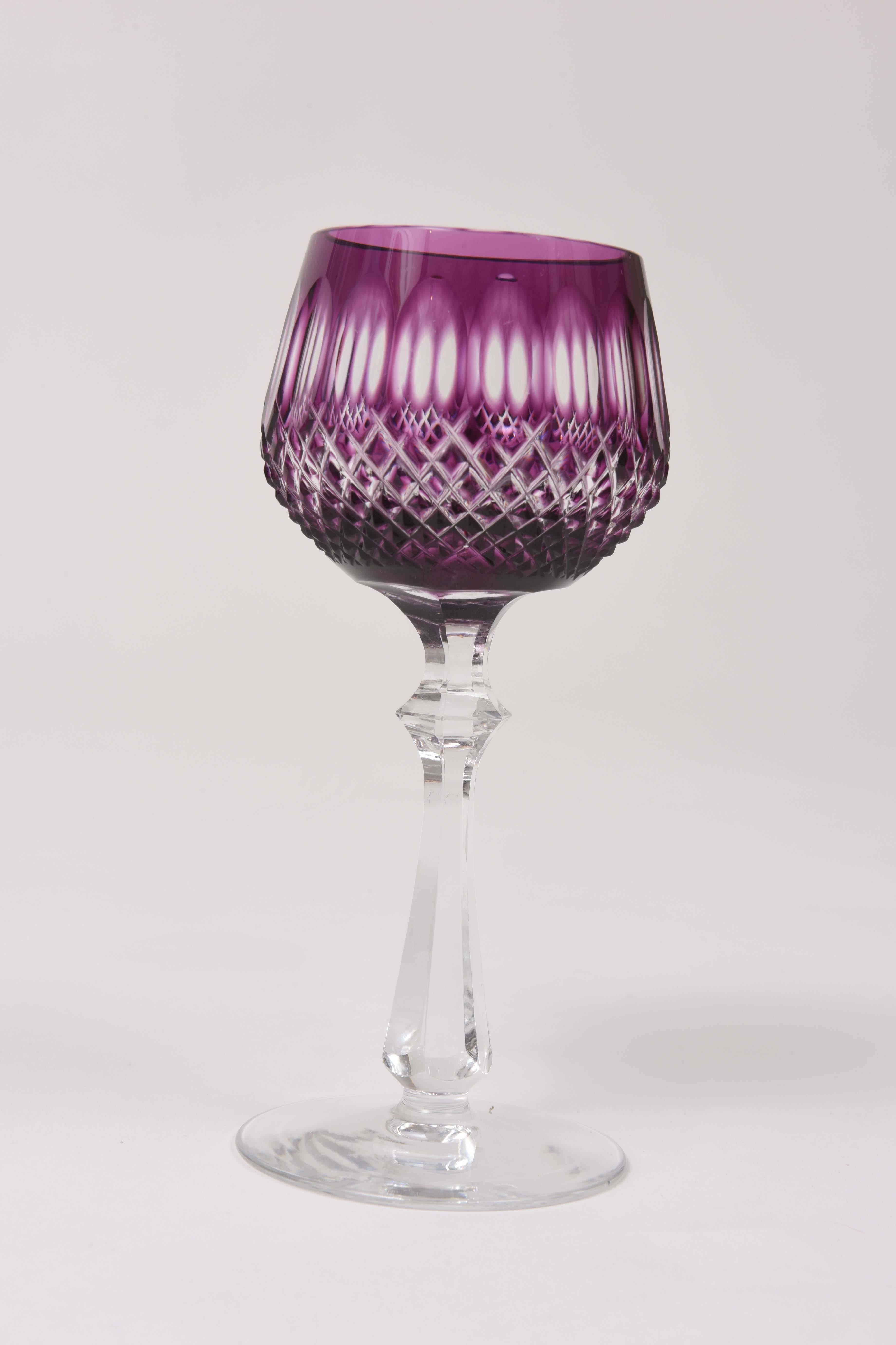 A set of nice cased and cut to clear amethyst wine glasses featuring a beautiful knob and fully cut stem. Perfect for mixing in with all your jewel tone colored wine goblets and fine crystal service.