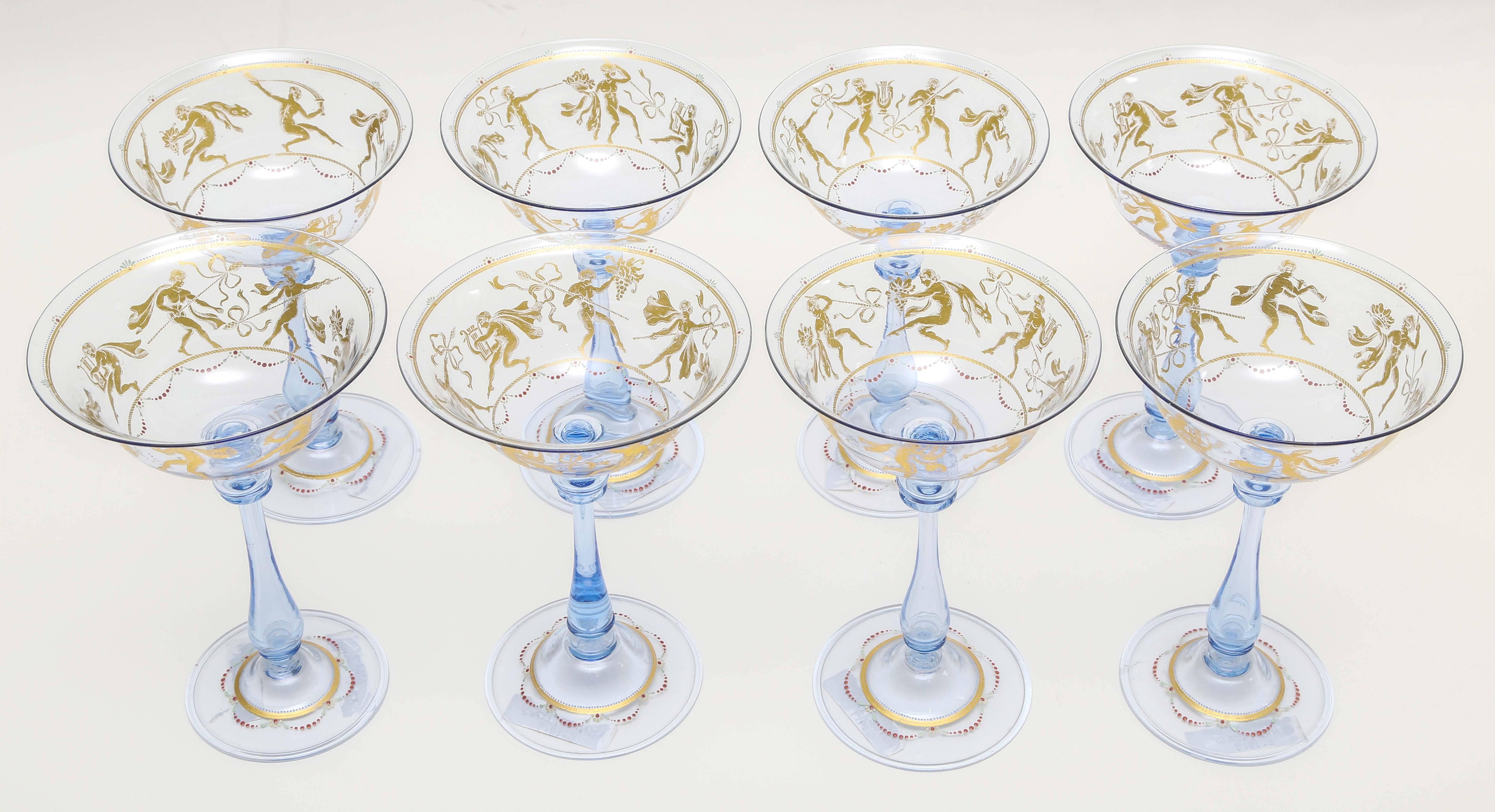Gorgeous blue Venetian champange coupe glasses featuring an all-over scenic surround with applied decoration, 24-karat gold decoration and blown inclusion. We love the swag beading and whimsical nature. These are nice and tall and well balanced. The