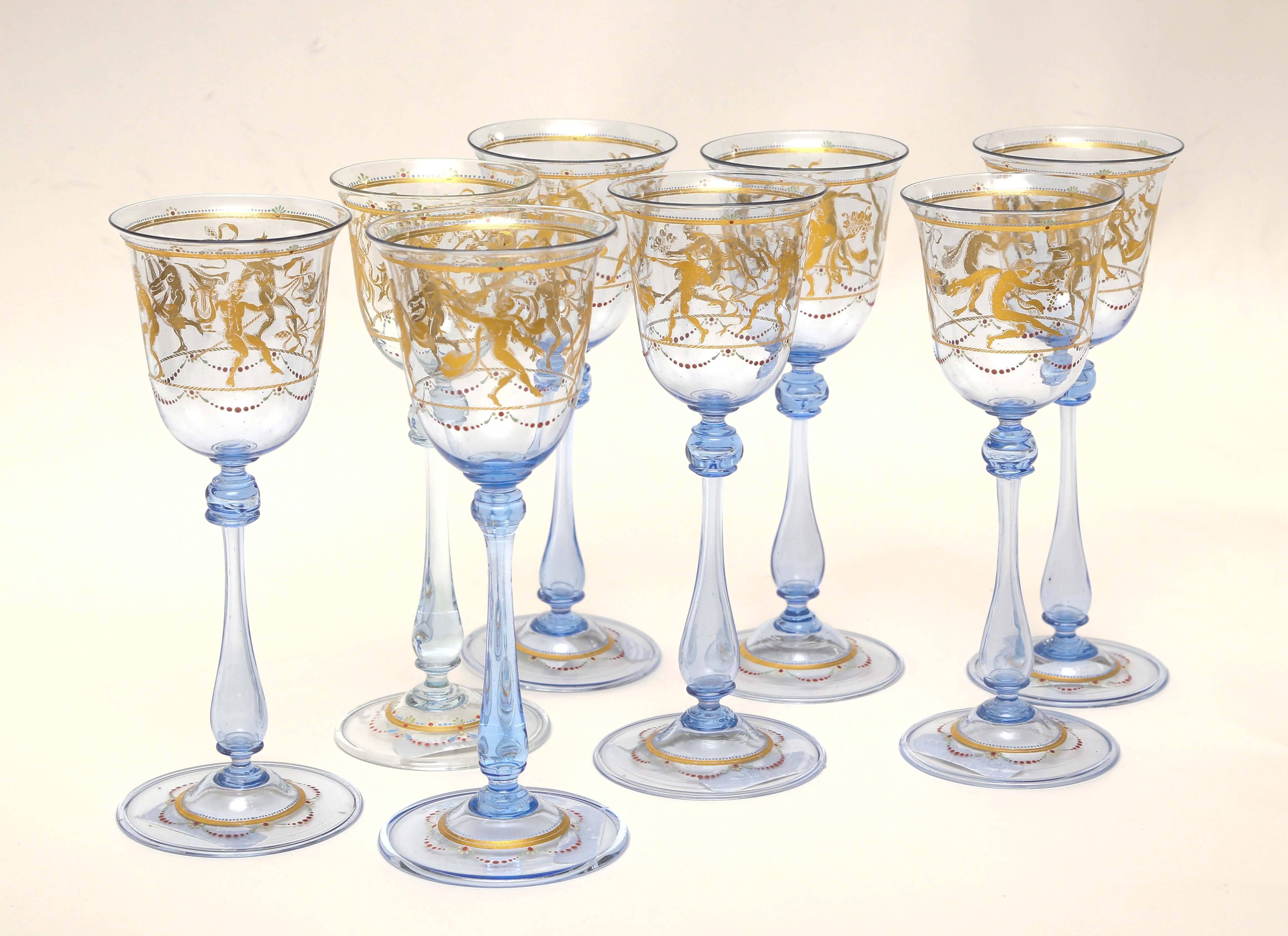 Gorgeous blue Venetian wine glasses featuring an all-over scenic surround with applied decoration, 24-karat gold decoration and blown inclusion. We love the swag beading and whimsical nature. These are nice and tall and well balanced. The extra