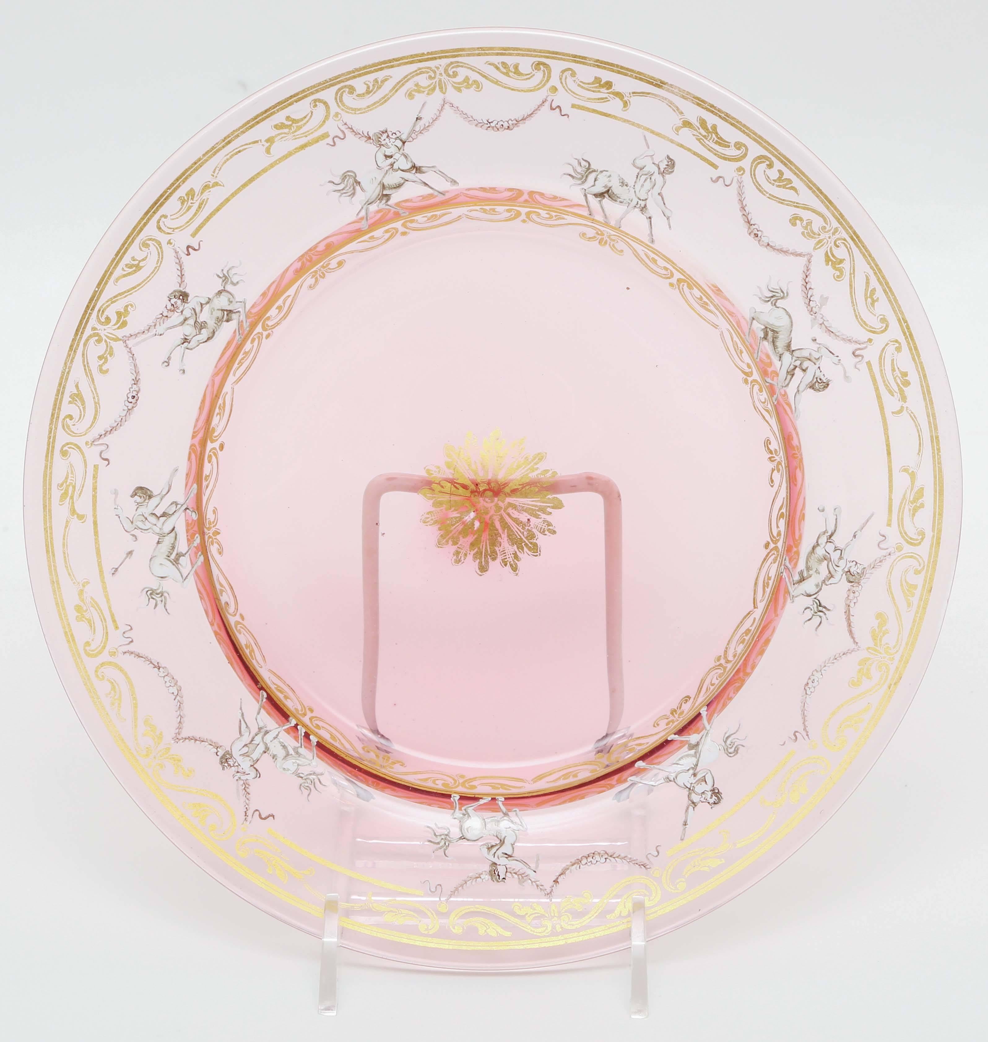 A charming set of Venetian glass plates in a nice soft shade of pink. Accented with hand painting and 24-karat gold blown inclusion. A great size for salad or dessert and would be stunning in a cabinet display. Please see our matching wine and water
