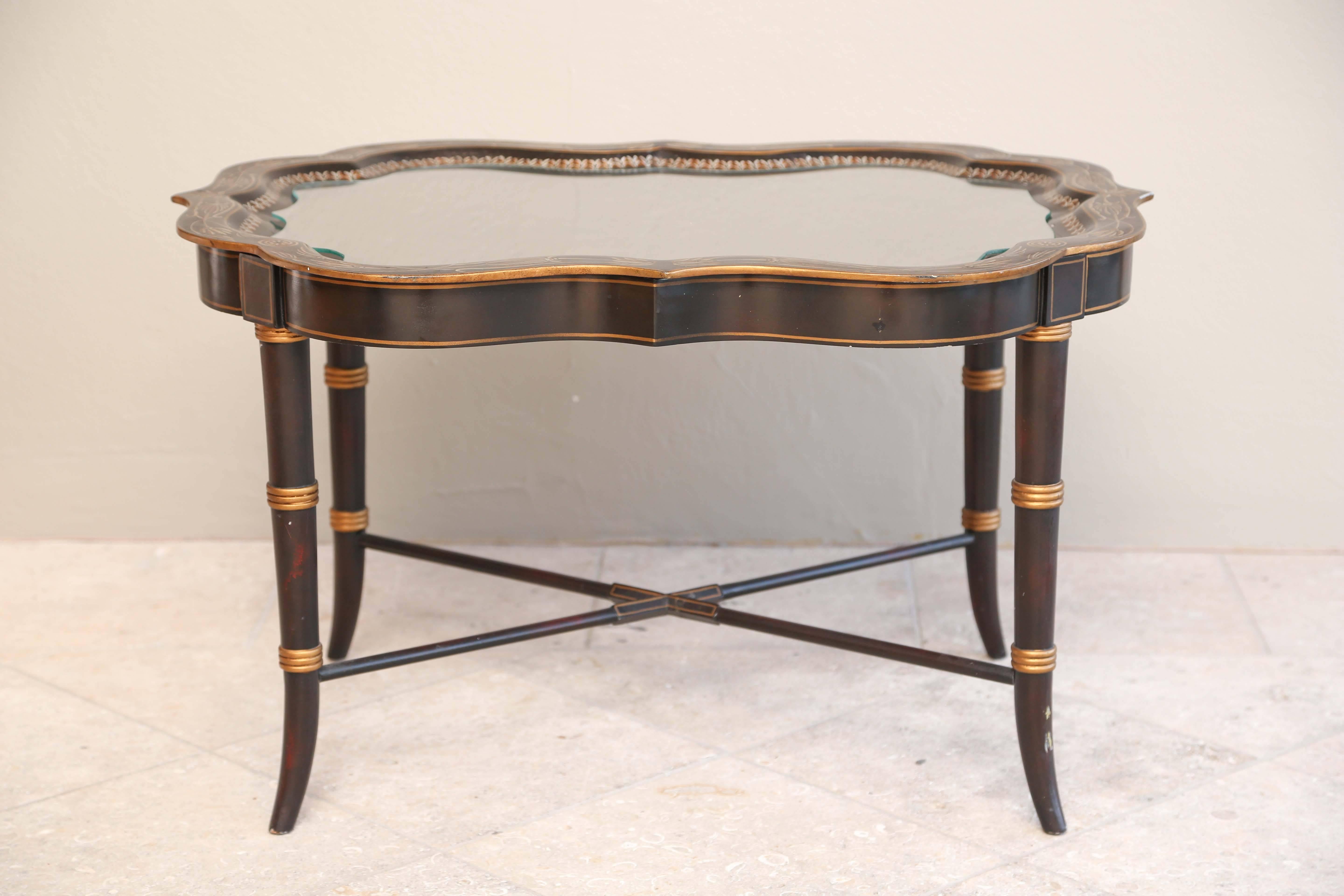A lovely and well proportioned coffee table with delicate turned legs, hand-painted gold leaf decoration and cross stretchers. This piece came with a custom cut-glass topper that fits nicely and will be included. We will list this as one piece but