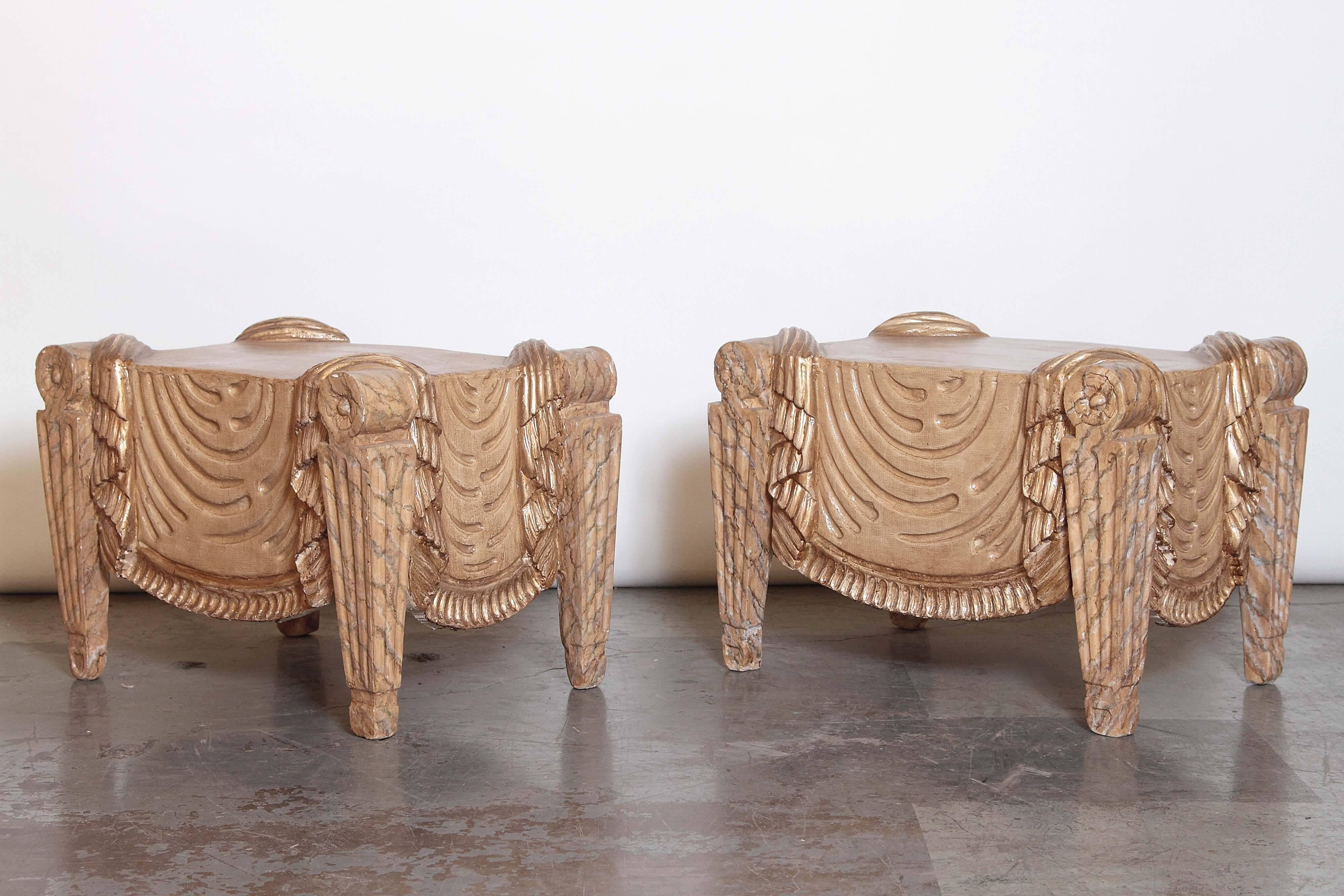 Painted, antique white, modeled as Roman fluted leg benches with encircling fringed drapery.