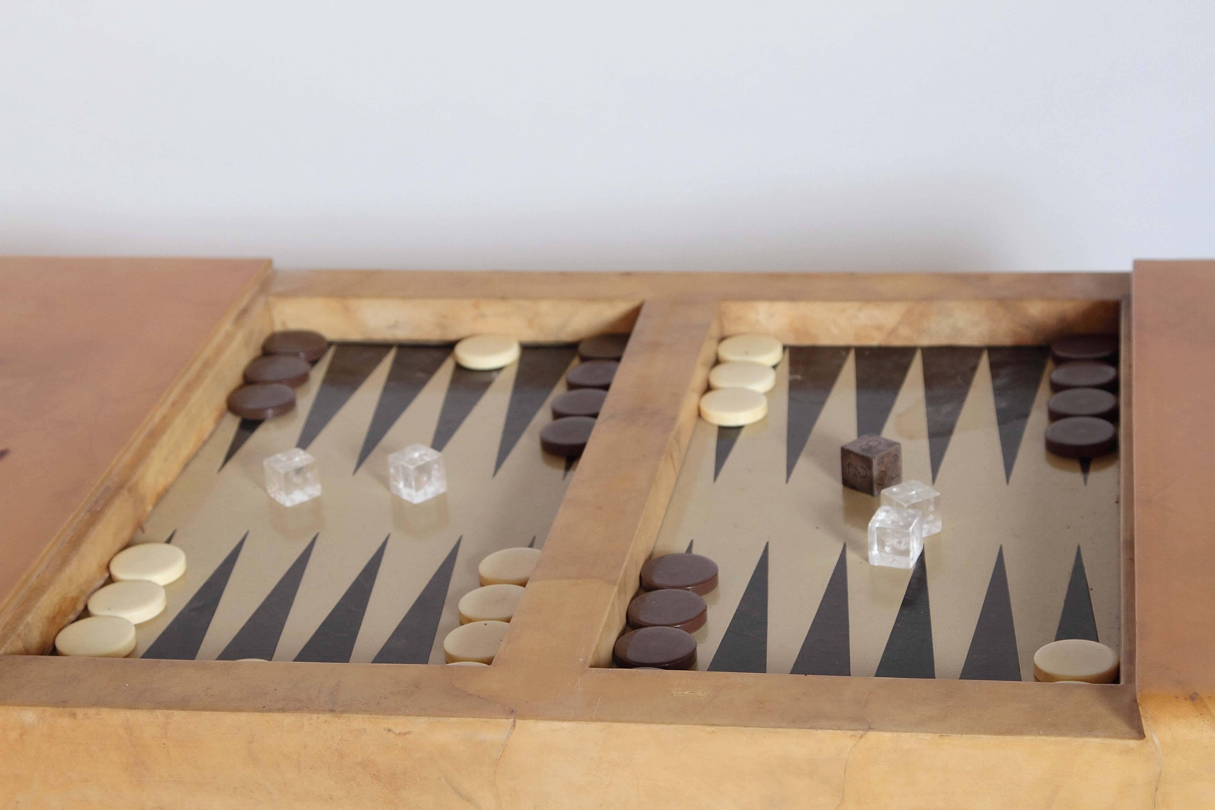 Rare Karl Springer Parchment (goatskin) backgammon table. Top slides to reveal backgammon board. Includes gaming pieces shown. So chic!