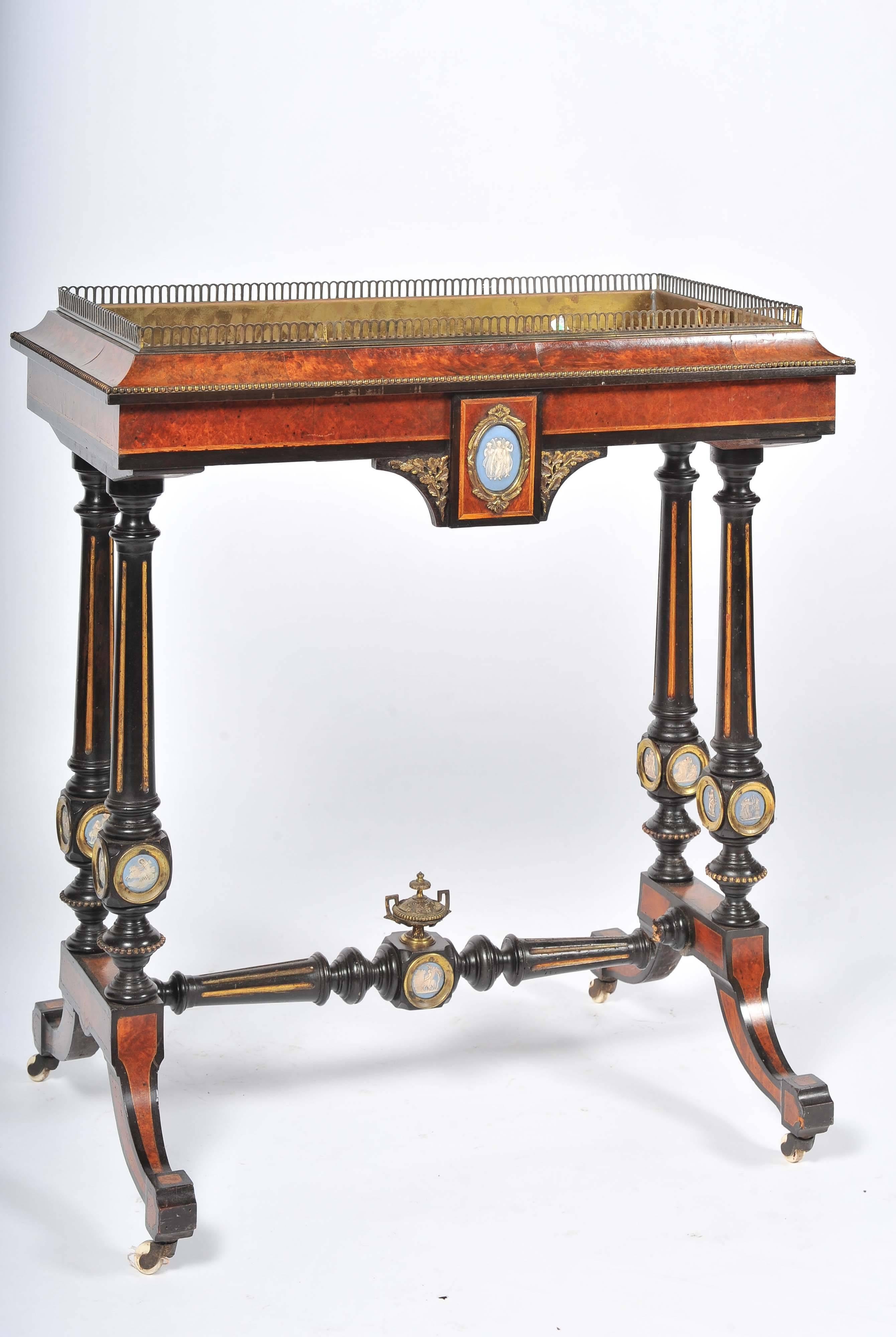 A good quality English 19th century amboyna, ormolu-mounted floor standing jardiniere with wedgwood plaques.