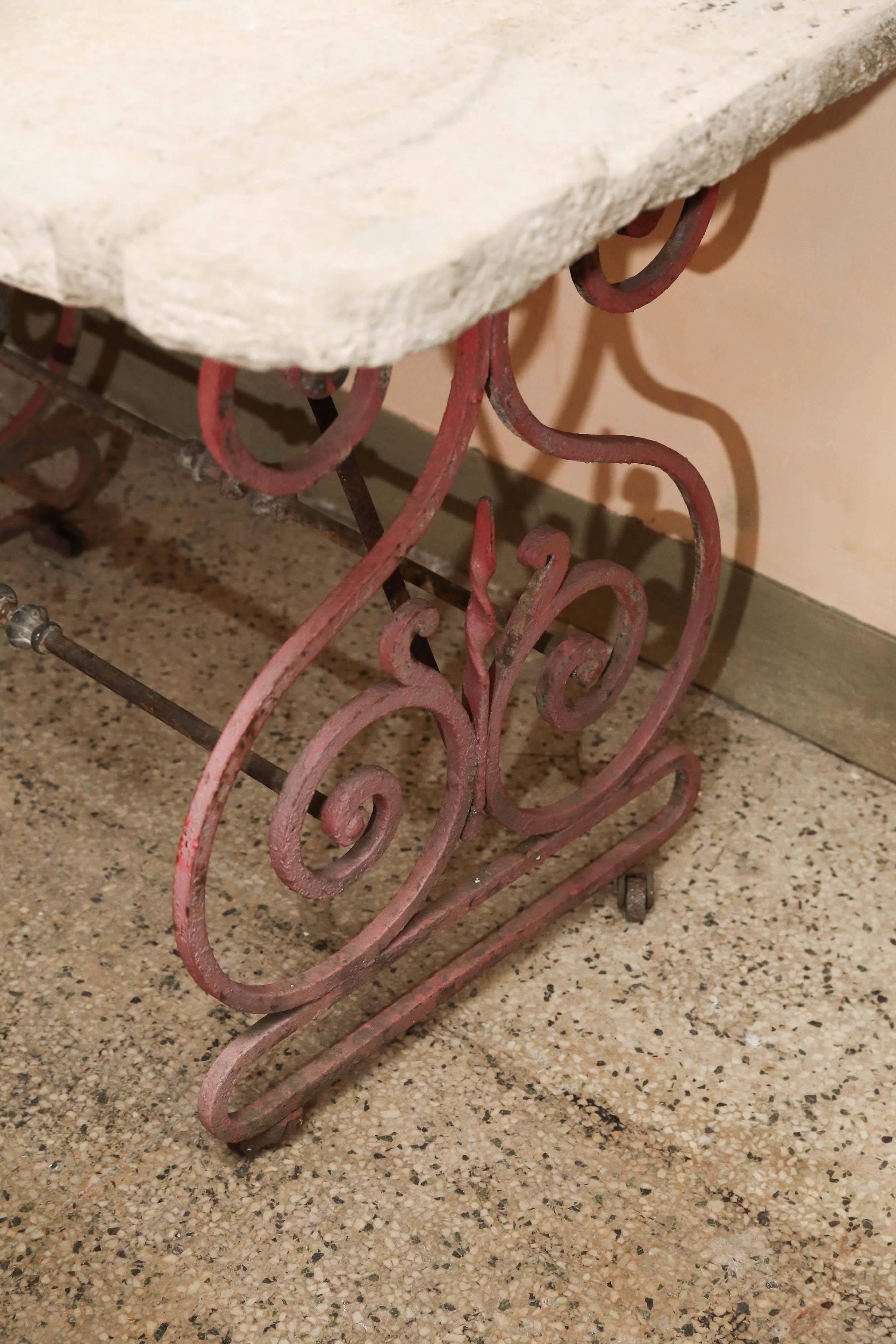 19th century French butcher table with original paint and iron casters. 2