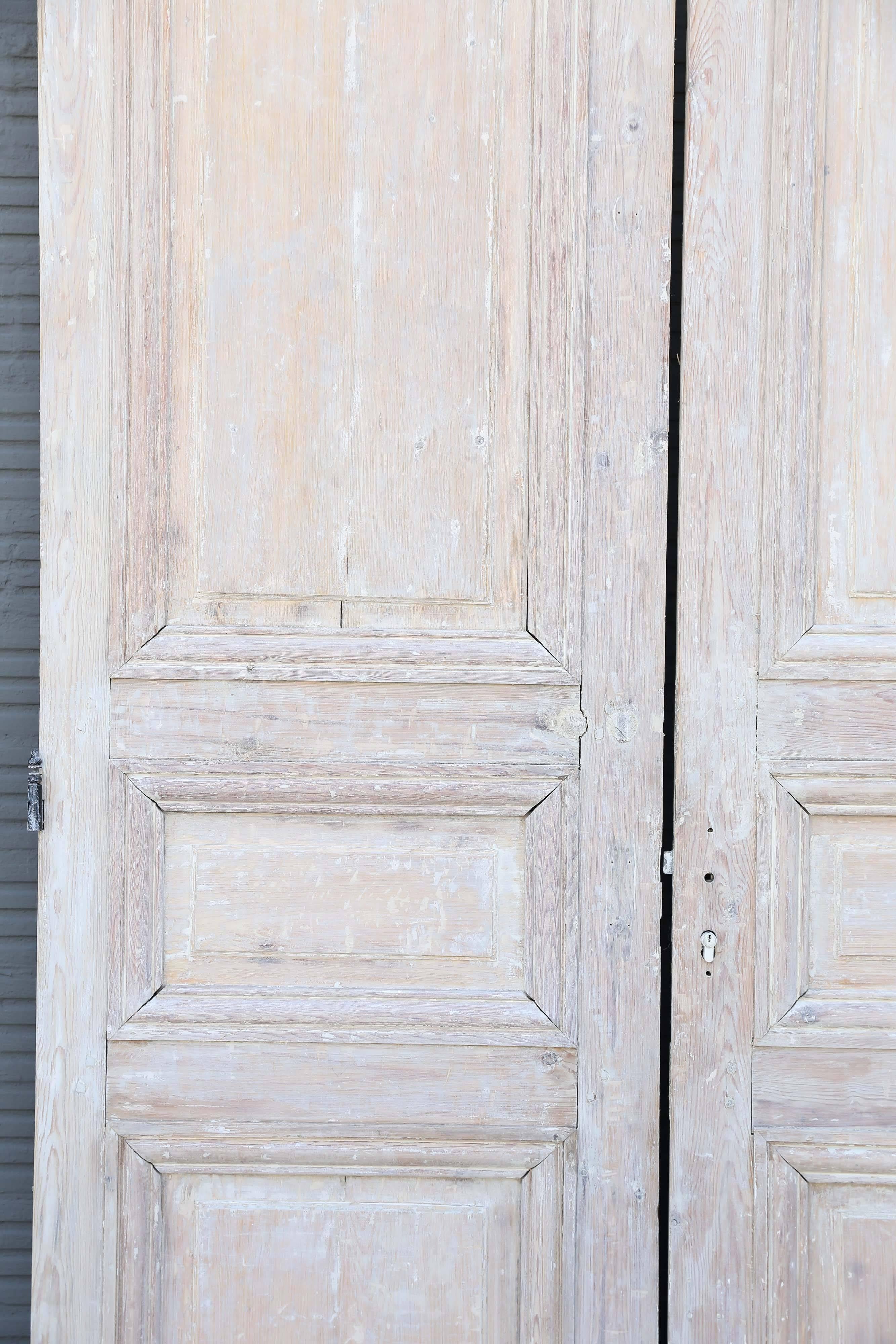 Pair of Louis XVI pine doors. The original paint has been stripped. Each door is 28.5