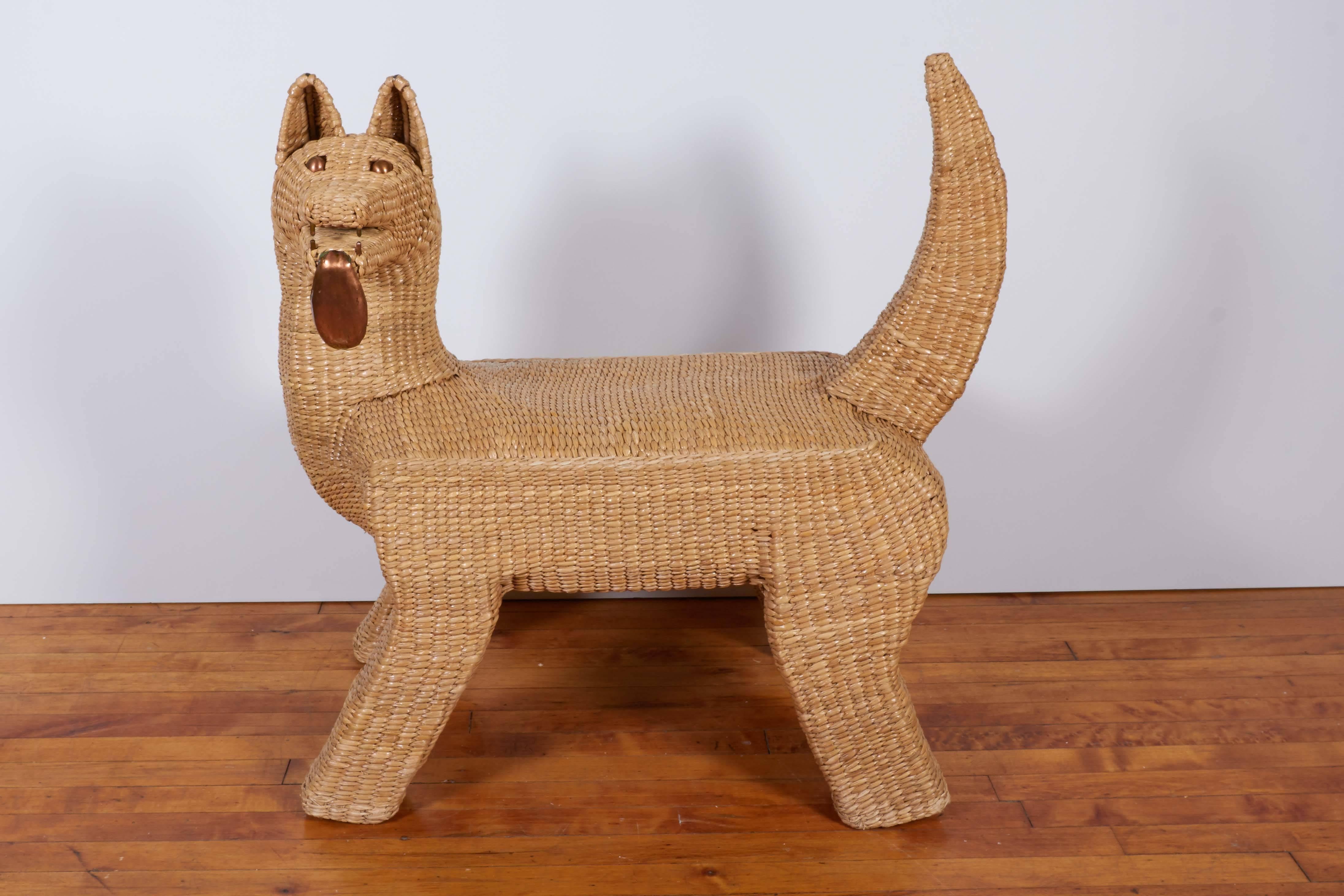 A sculptural bench by artist Mario Lopez Torres, produced in Mexico, circa 1970s, designed as a coyote, crafted of woven wicker, the eyes teeth and tongue in copper. Includes the artist's signature and date to the underside of the seat. Very good