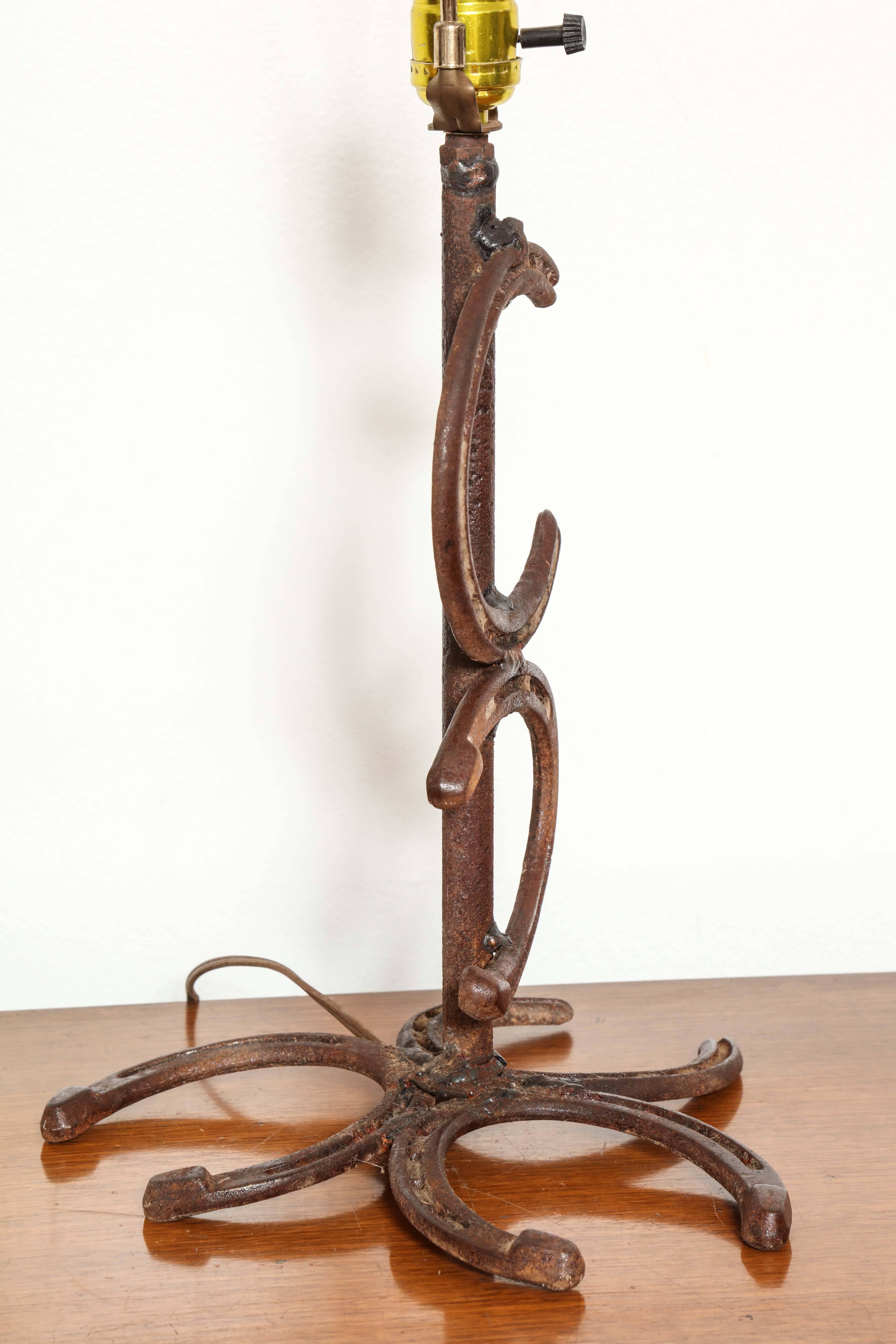 Early 20th Century Pair of Hand-Forged Horseshoe Lamps For Sale
