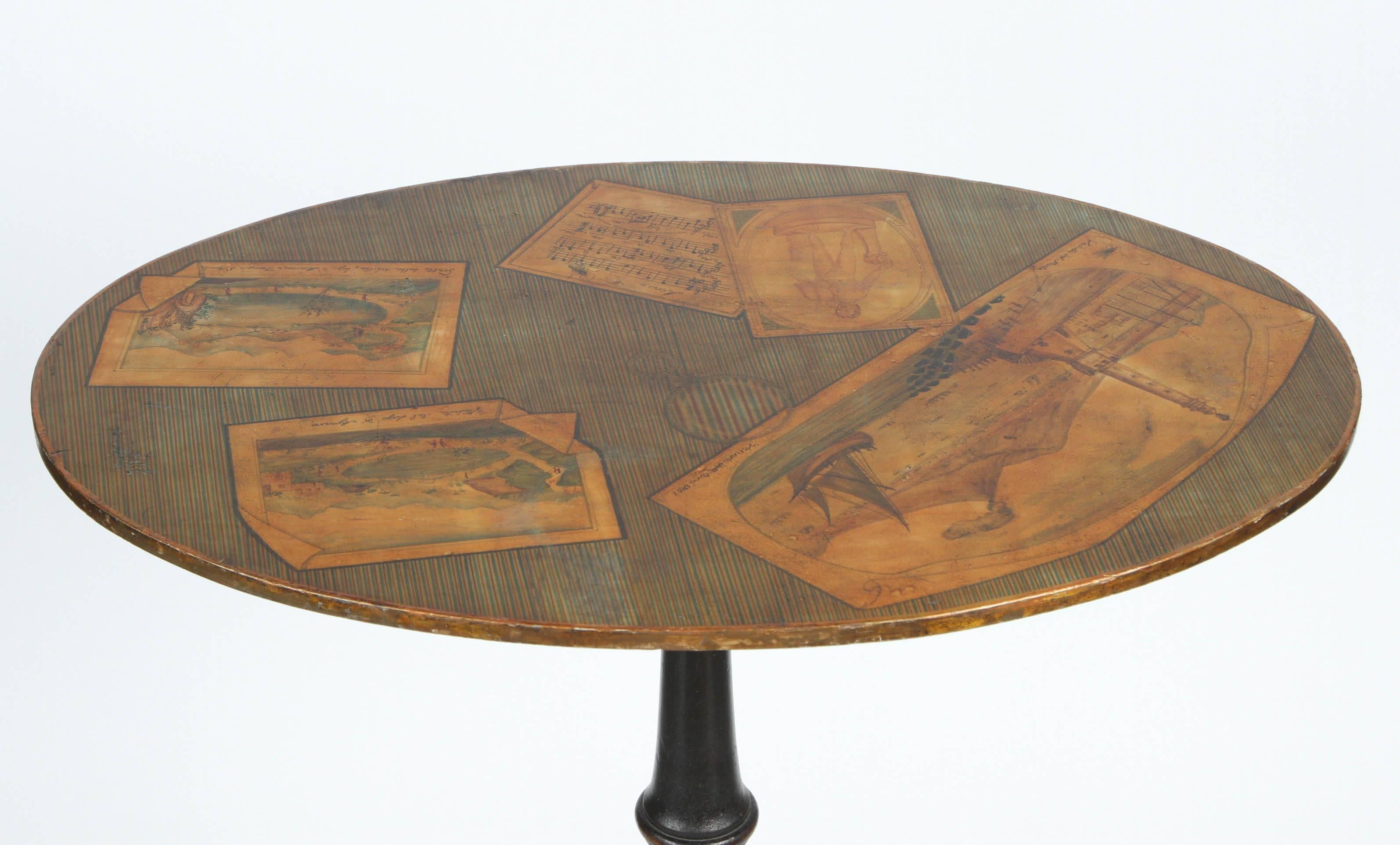 A 19th century English end table with Trompe L'oeil paintings of Italian Grande tour scenes (including Vesuvius erupting) on a tripod base.