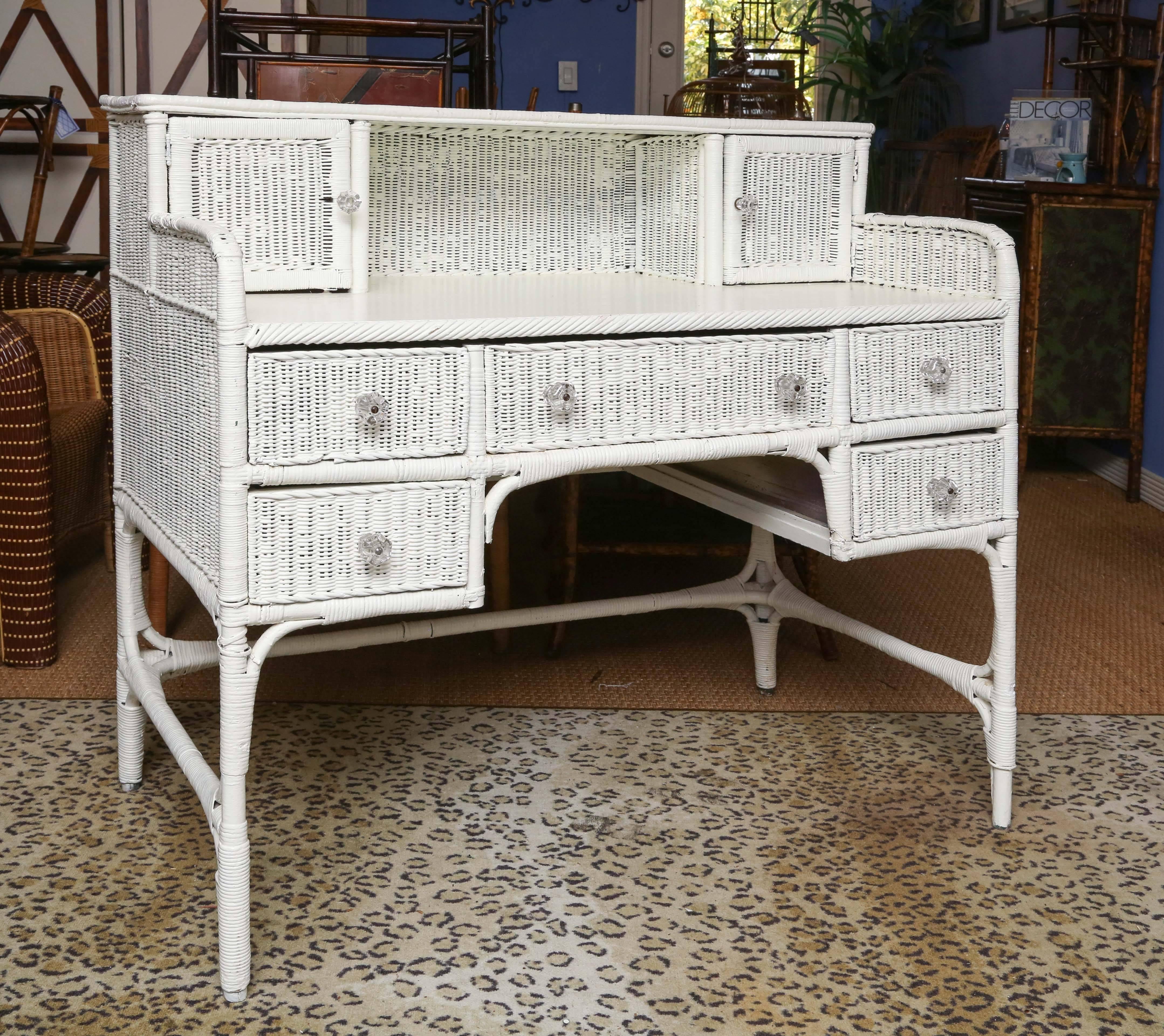 Sweet white wicker writing desk with six drawers and two compartments. Good condition.
