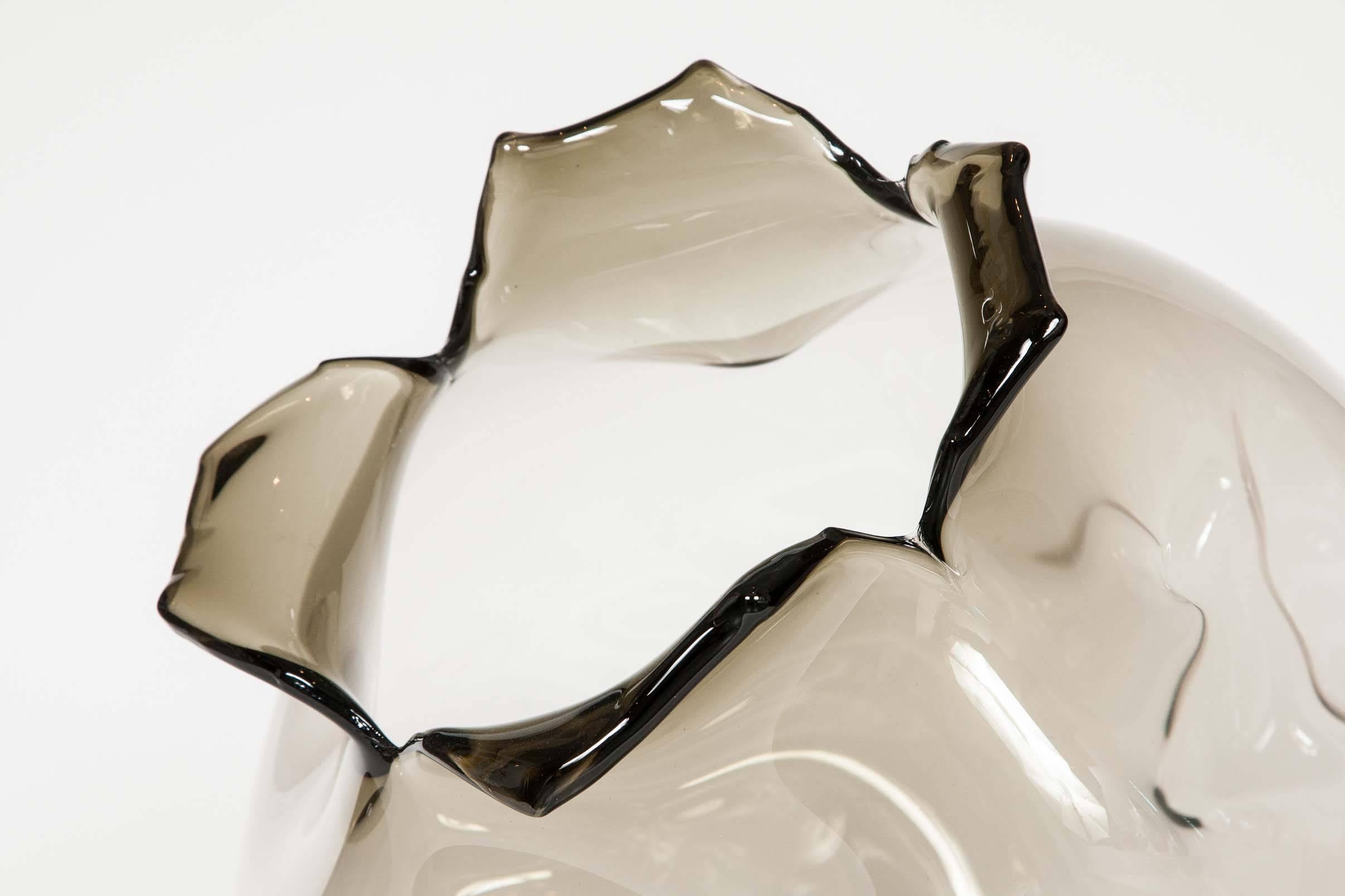 Spirit Fruit in Bronze is a unique freehand blown glass sculpture by the French-American artist Jeremy Maxwell Wintrebert. This piece is all about its beautiful form, a simple soft bronze colour is used to showcase the undulations and movement of