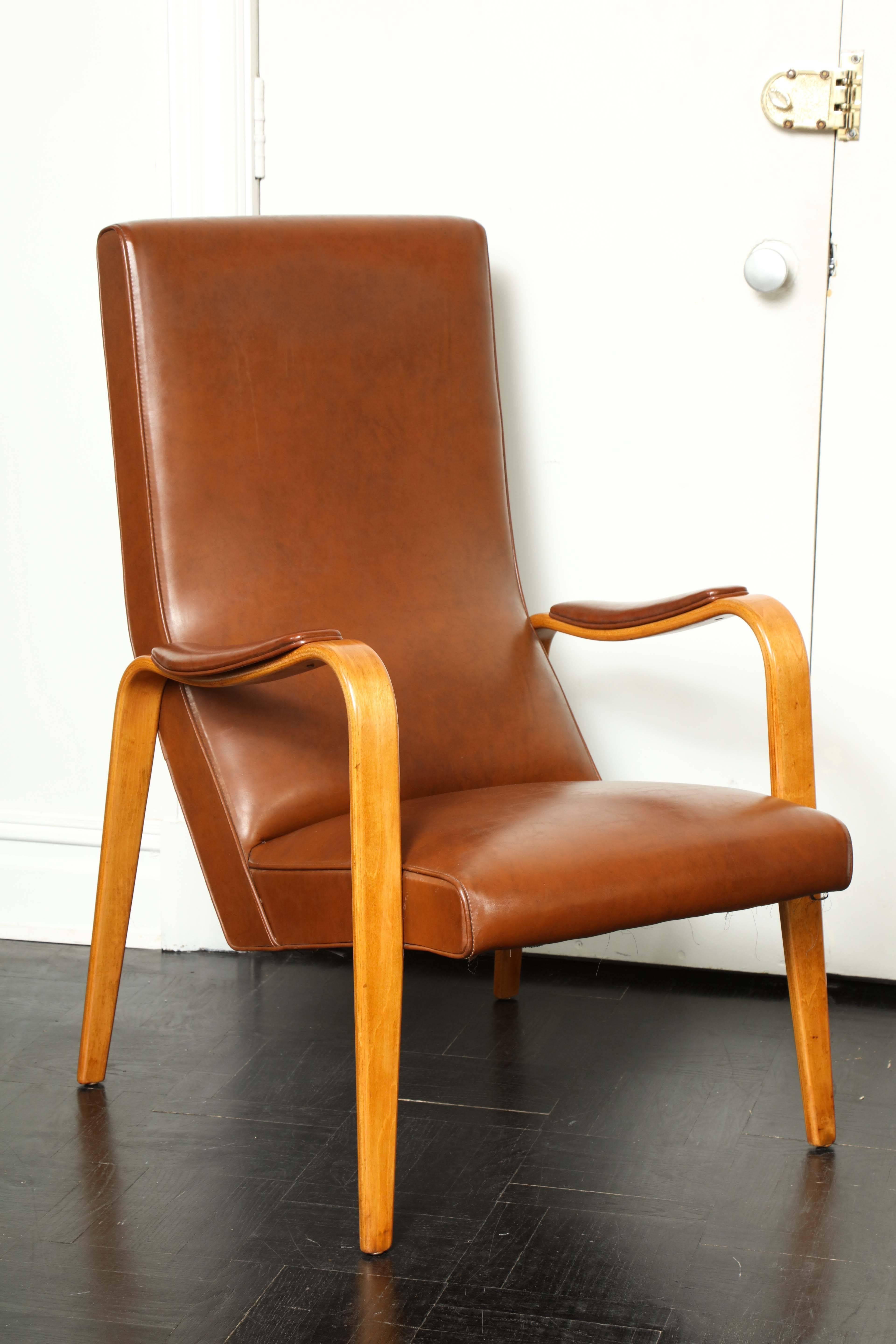 Mid-20th century walnut and leather open armchair.
'Thonet.'