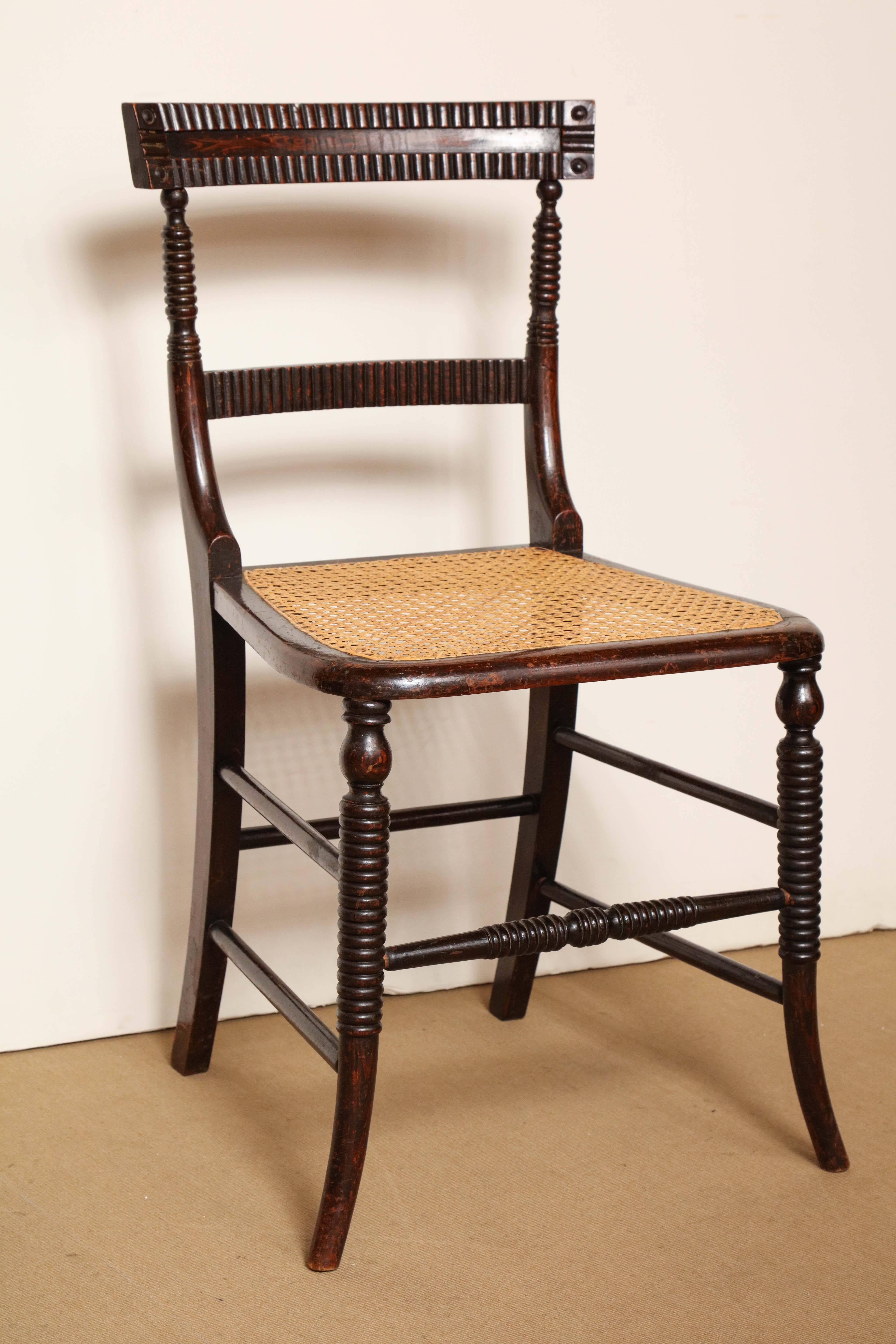 Early 19th century English regency faux rosewood caned chair.