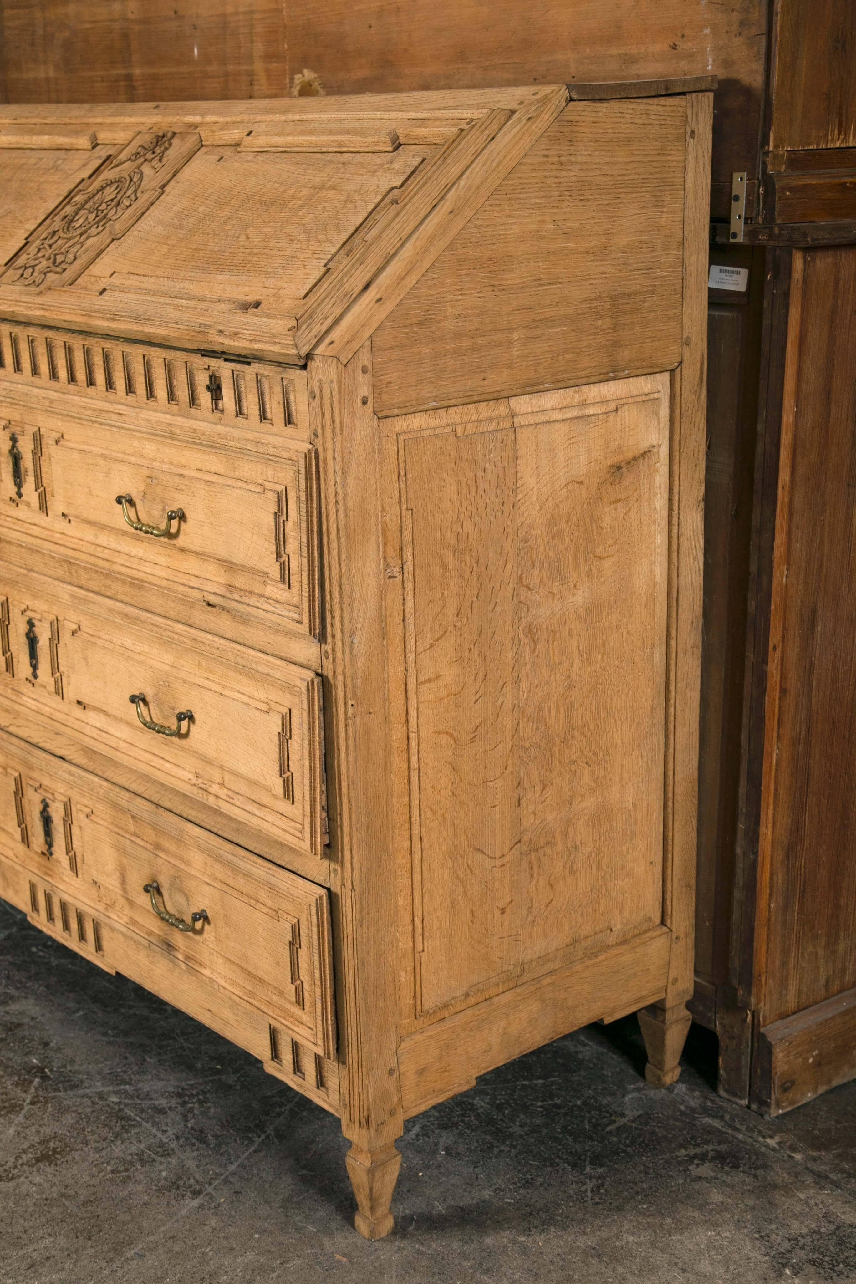 Carved French drop front secretary with three-drawer chest.