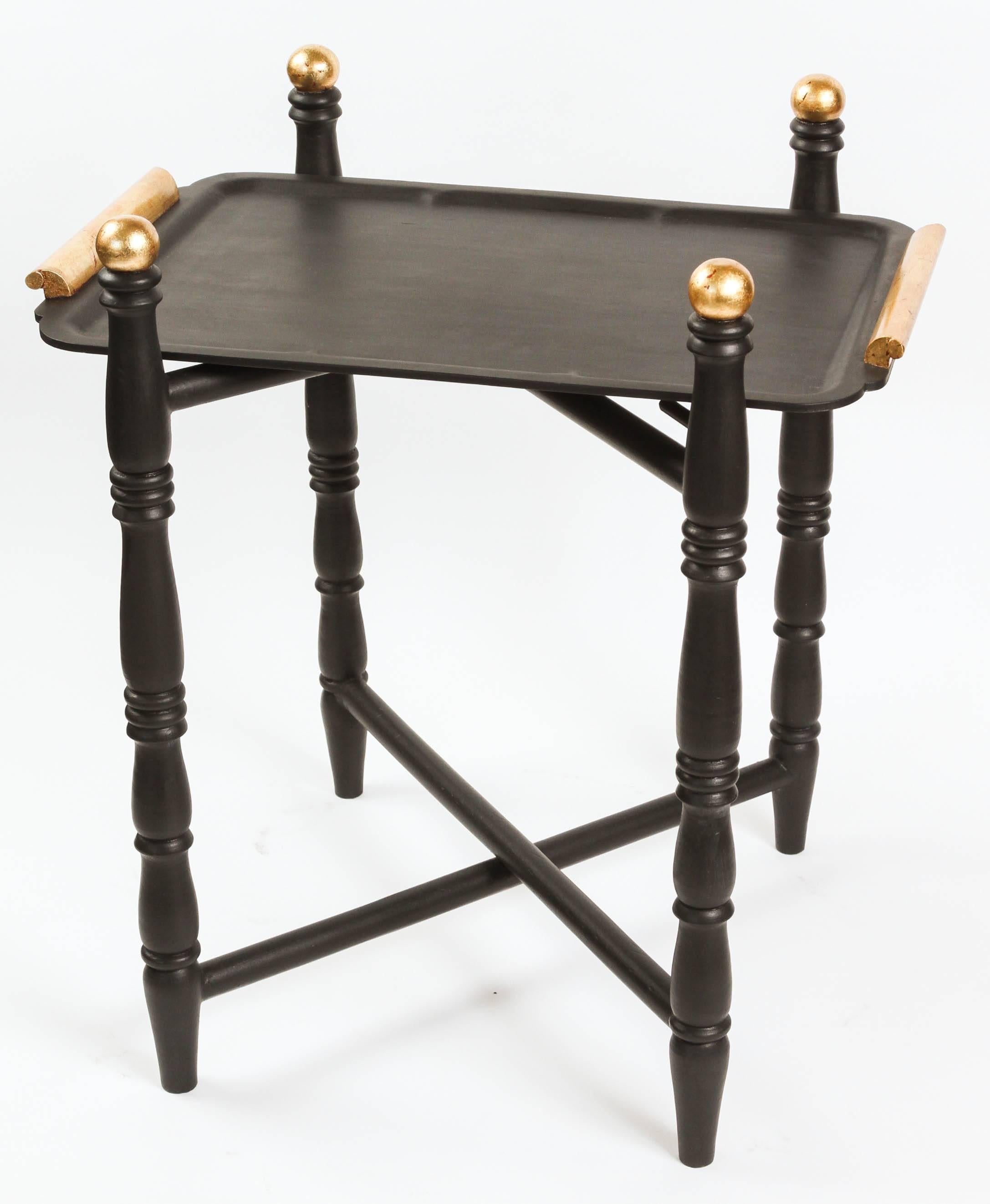 Vintage folding wood tray table newly painted in matte black and gold leaf.

Tray: W 22.25 x L 14.5 x H 1.5.