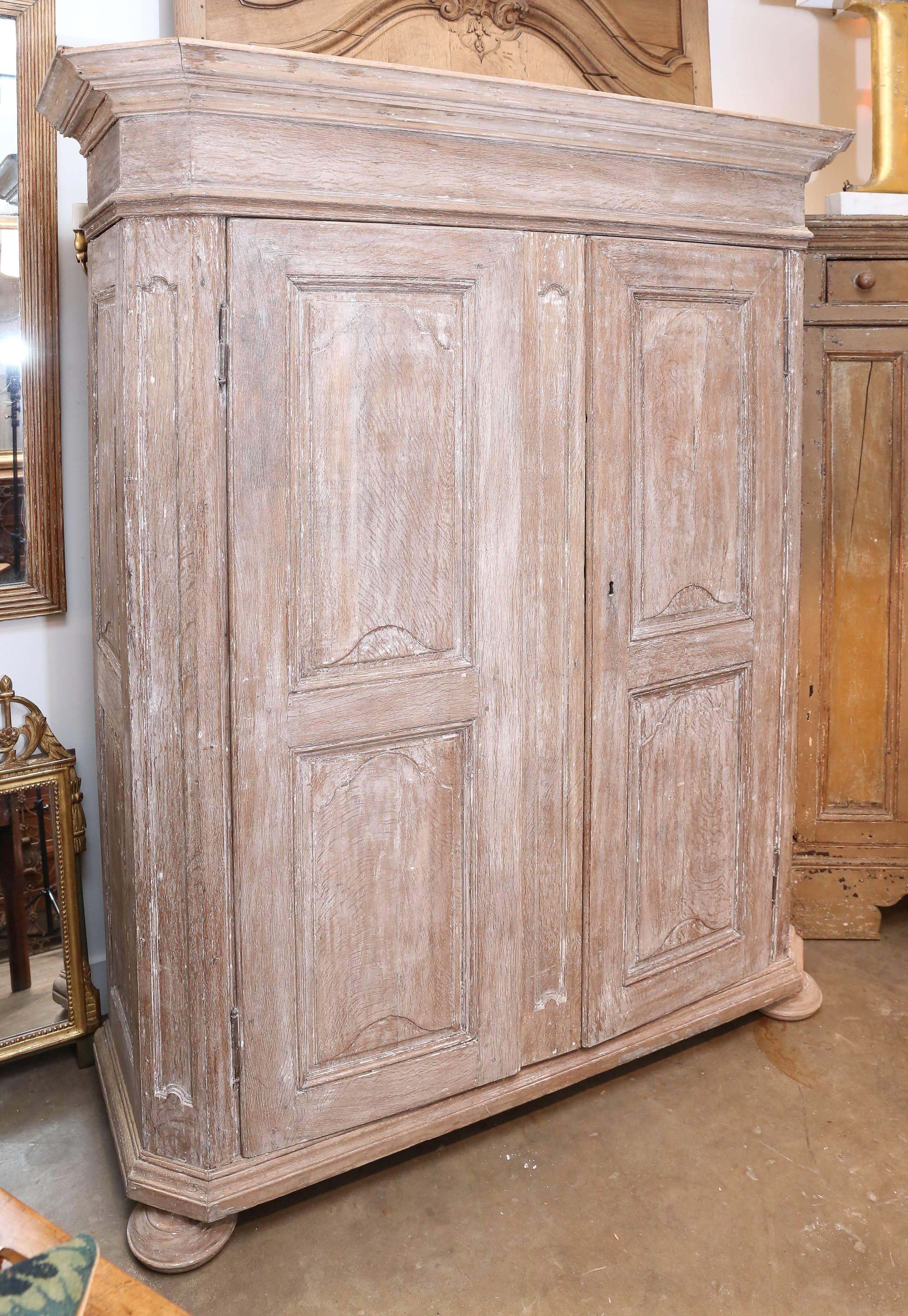 19th Century Northern European armoire with original scraped paint. Beautiful simple architectural design. Armoire breaks down into several pieces for easy transport. Beautiful bleached grained wood underneath. Door opening: W: 48.5
