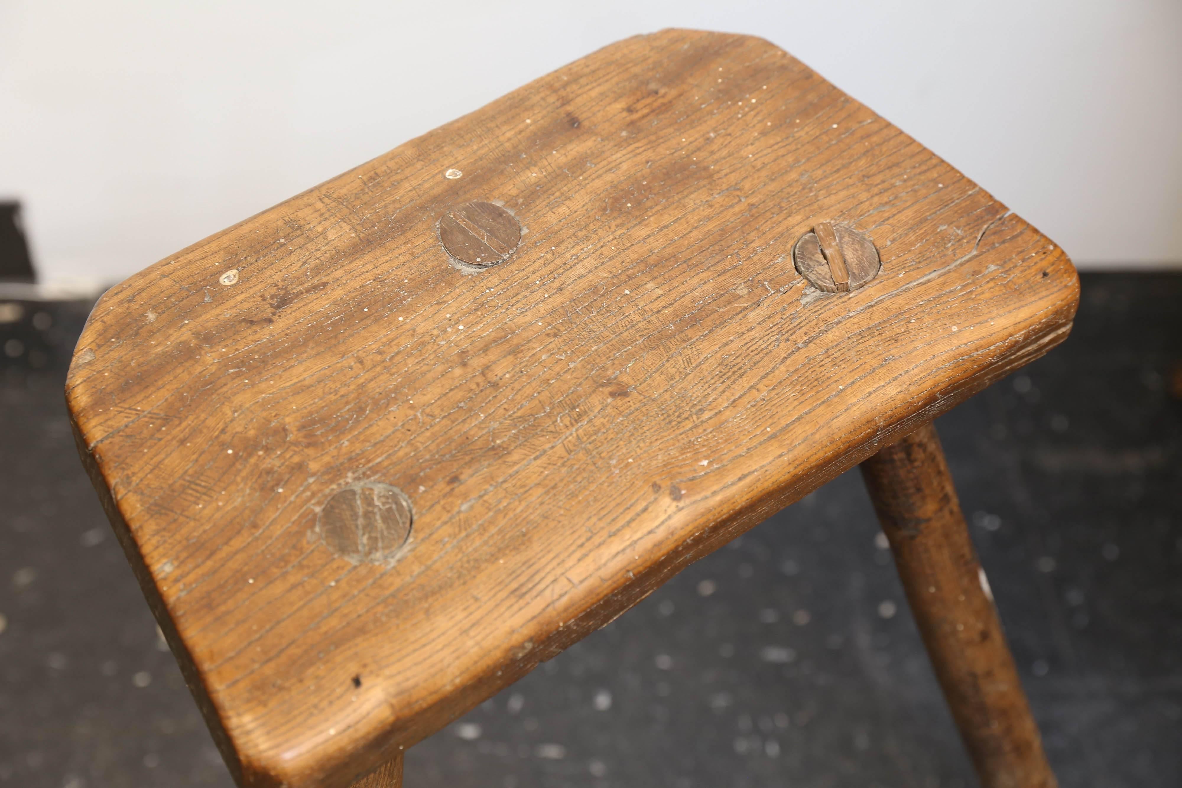 Early 19th century English Cutler's stool used by workmen in the Sheffield Cutlery Company. Legs have ribbed detail. Beautiful patina. Would make a wonderful Primitive side table.