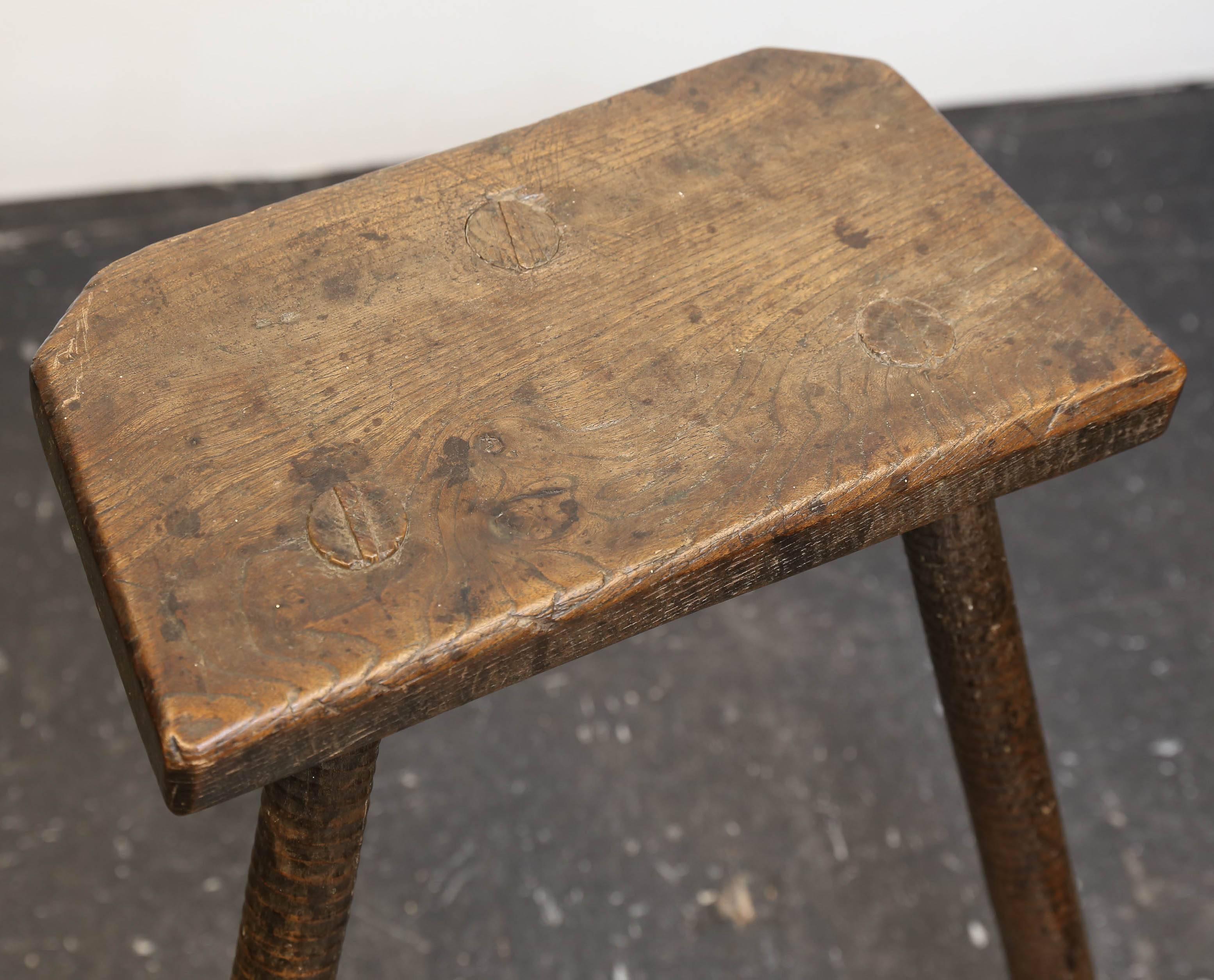 Early 19th century English cutler's stool used by workmen in the Sheffield Cutlery Company. Legs have ribbed detail. Beautiful patina. Would make a wonderful Primitive side table.