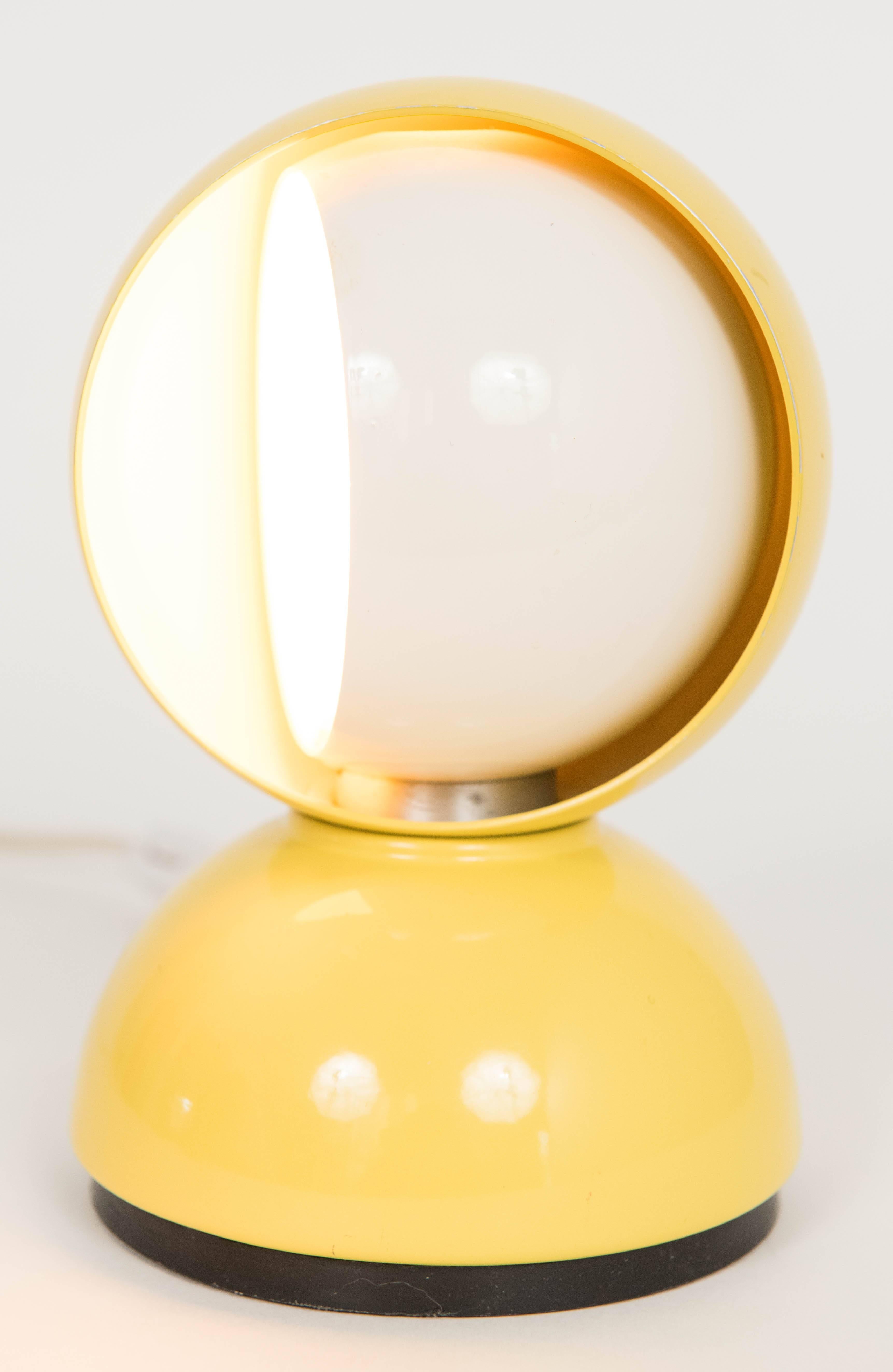 Yellow and white standing or wall mounted eclisse lamp designed by Vico Magistretti for Artemide.
