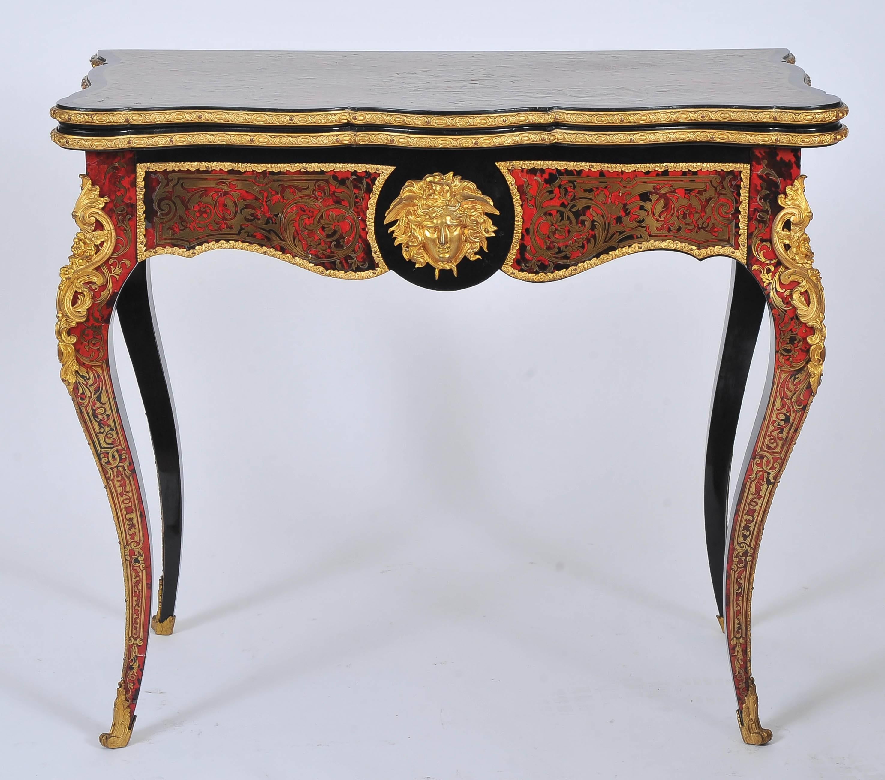 This stunning pair of ornate card tables designed after André-Charles Boulle, a Superior French Cabinet maker. They feature a lavish partie and contra partie design with delicately shaped cabriole legs and sabot feet. The interior has a fitted and