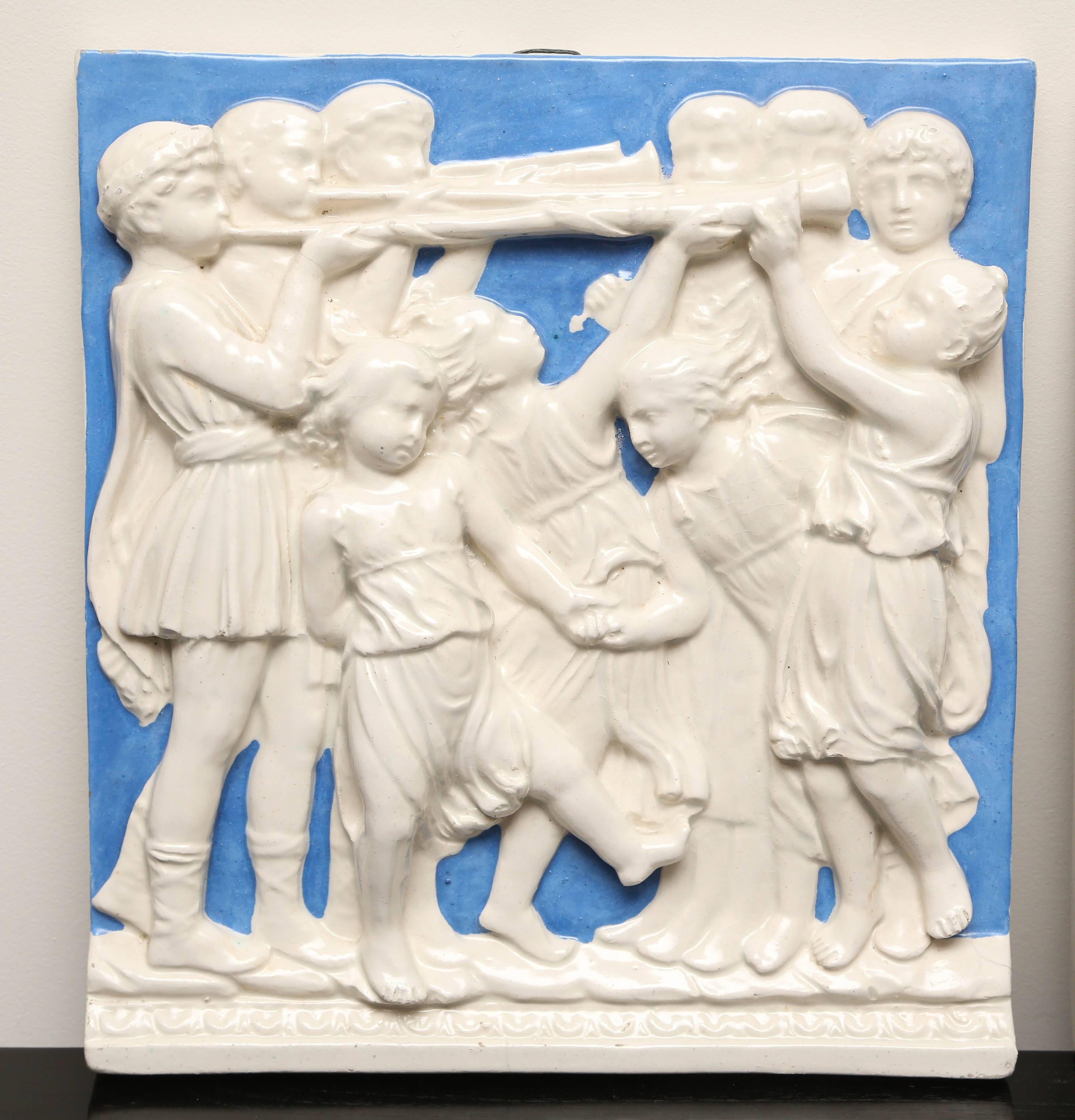 Charming pair of Romanesque type plaques featuring gentlemen, maidens and children.