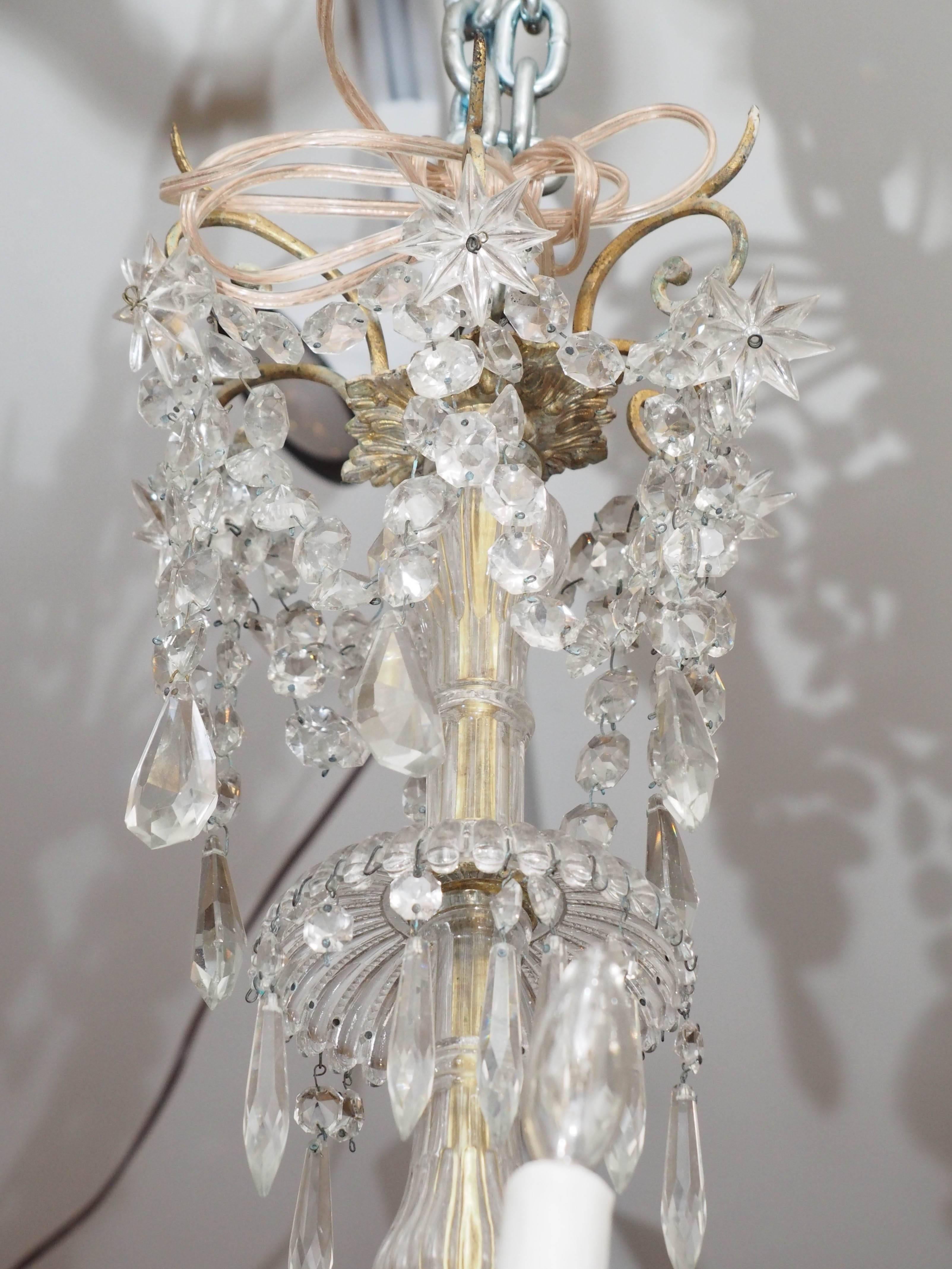 French Napoleon III gilt bronze and Baccarat crystal chandelier with 18 lights. This chandelier has been re wired but with no guarantee after transport, it should be checked over. All chandeliers come with canopy and chain and silk cord cover and