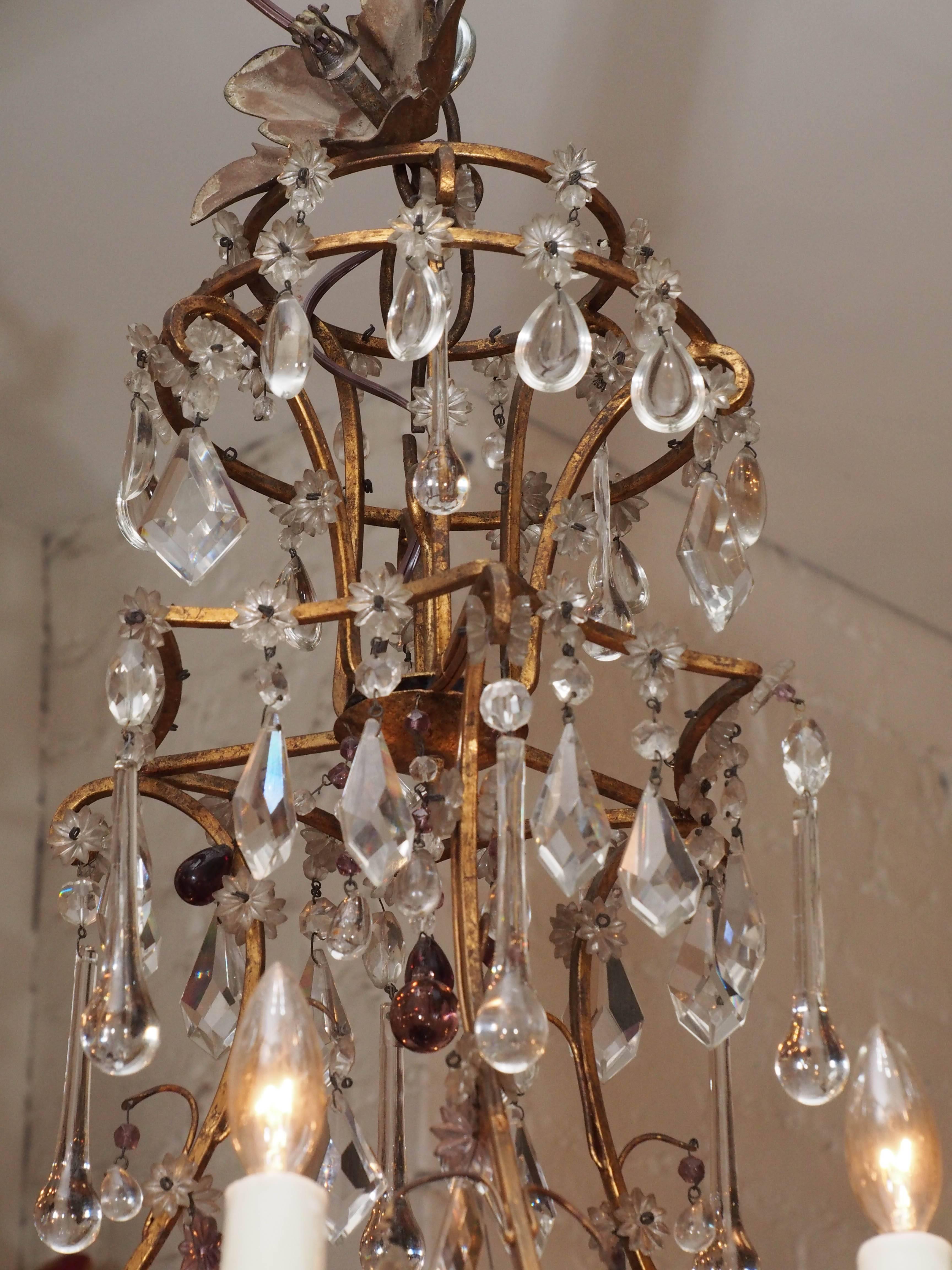 Italian cage form gilt iron and crystal chandelier with six lights.