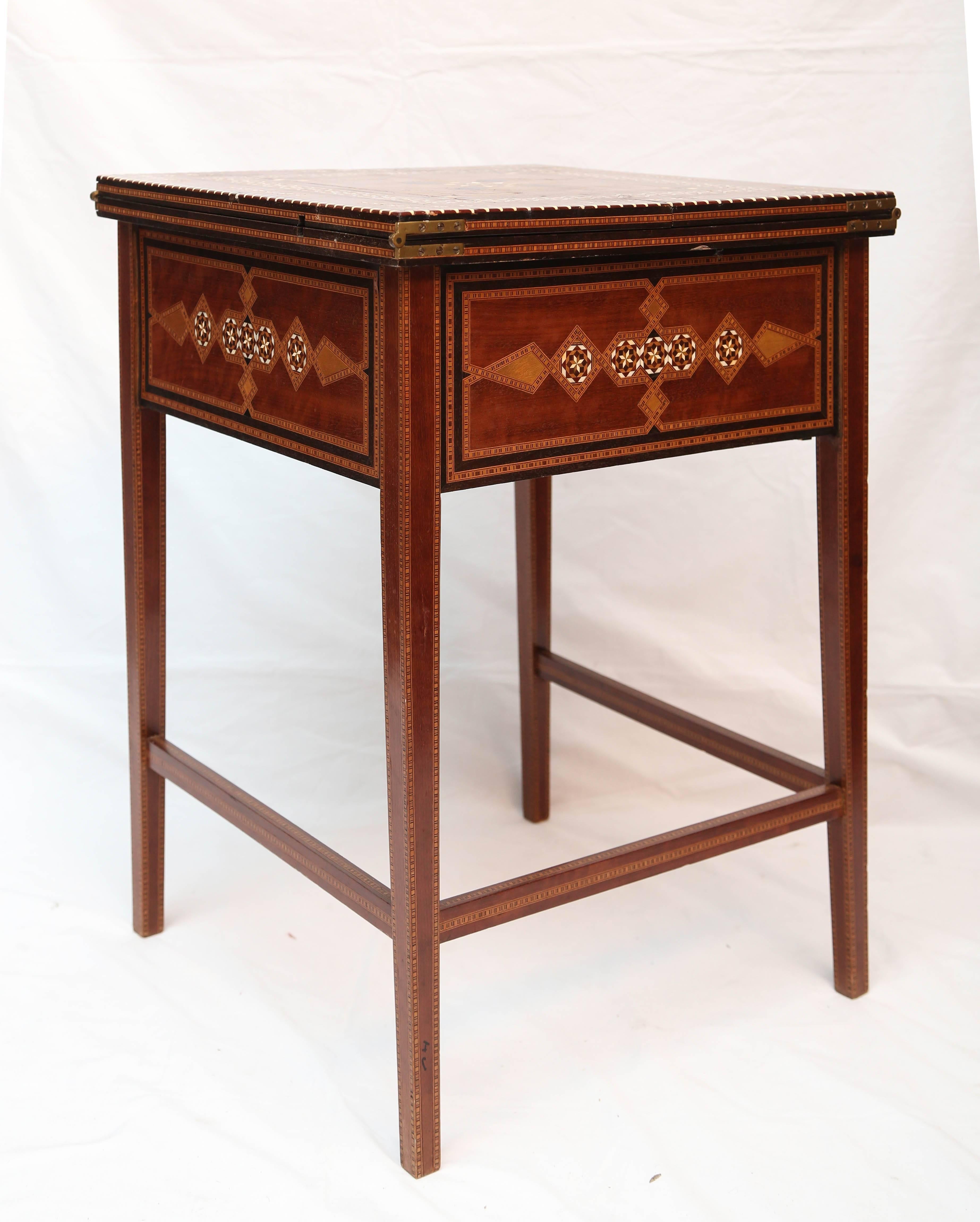 A plethora of inlays abound in this finely made, space efficient lady's desk. It is fitted with letter racks, an inkwell and finely appointed drawers. The desk 