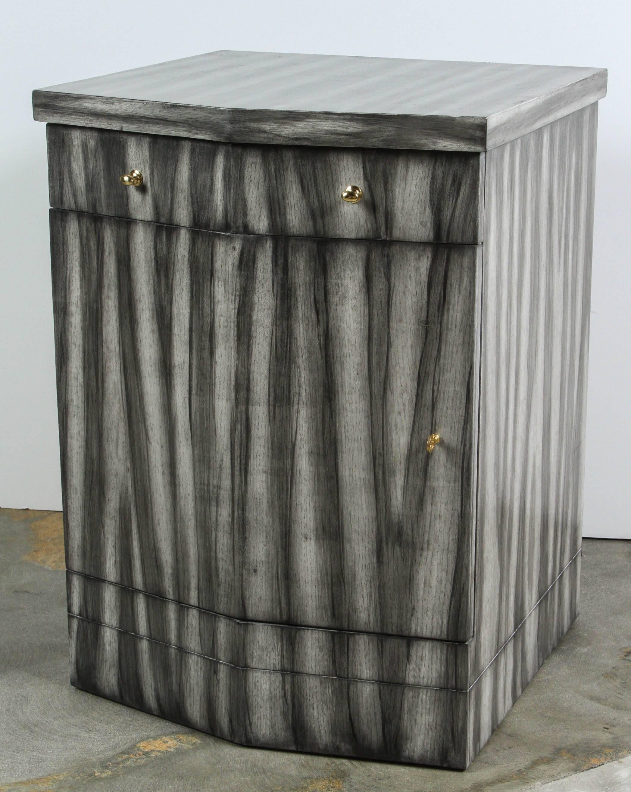 Paul Marra Pinnacle Nightstand shown in grey zebra finish with one drawer and one door. There is a pair available or order for single. Price is per each.