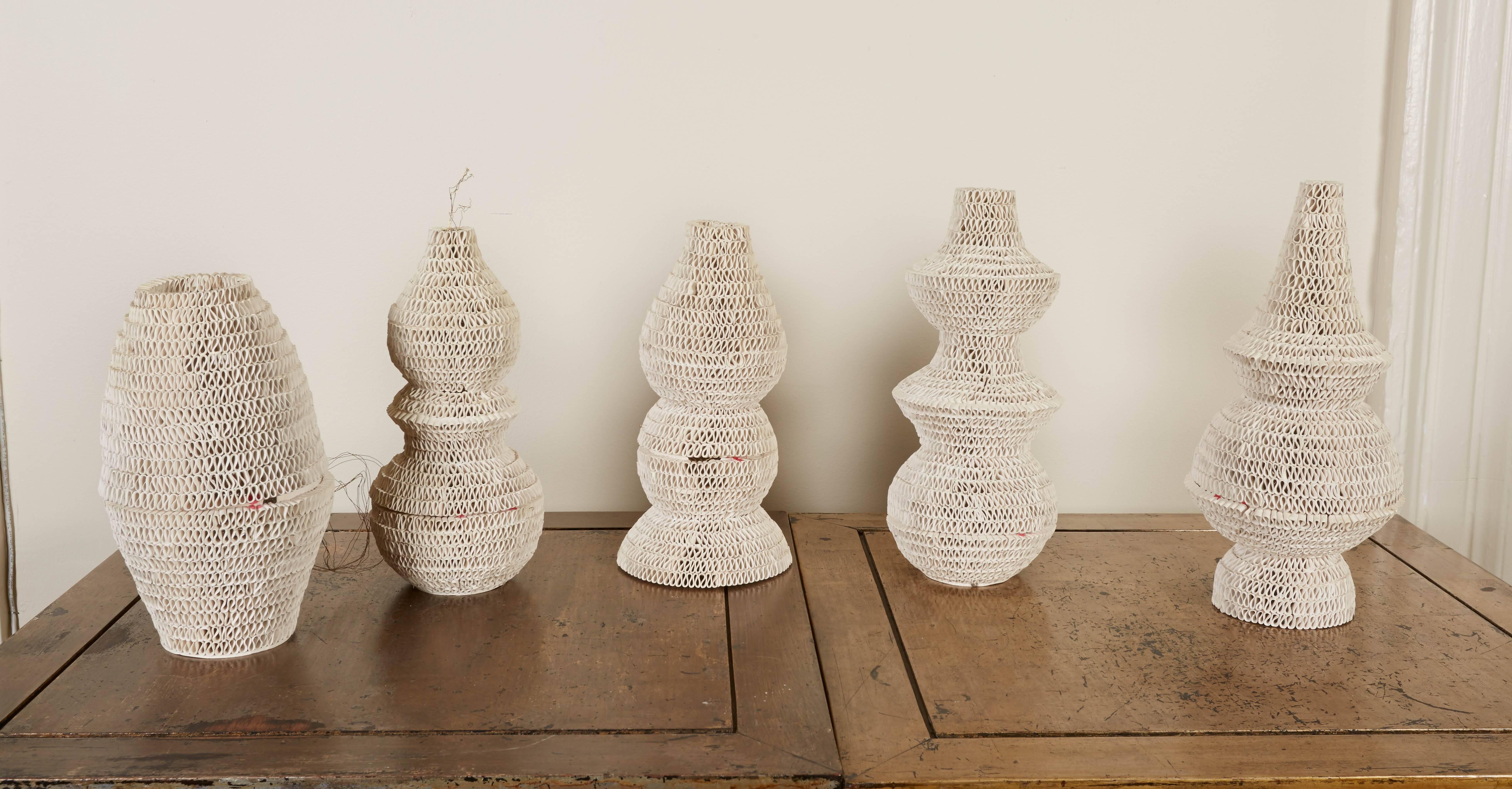 Each of the lanterns a unique form and made of hand-scrolled unglazed white terra cotta. This is the last set from the limited edition of 3 designed by Lucio Romero of prototype zero in collaboration with Piero di Terlizzi. Can also be sold as a set