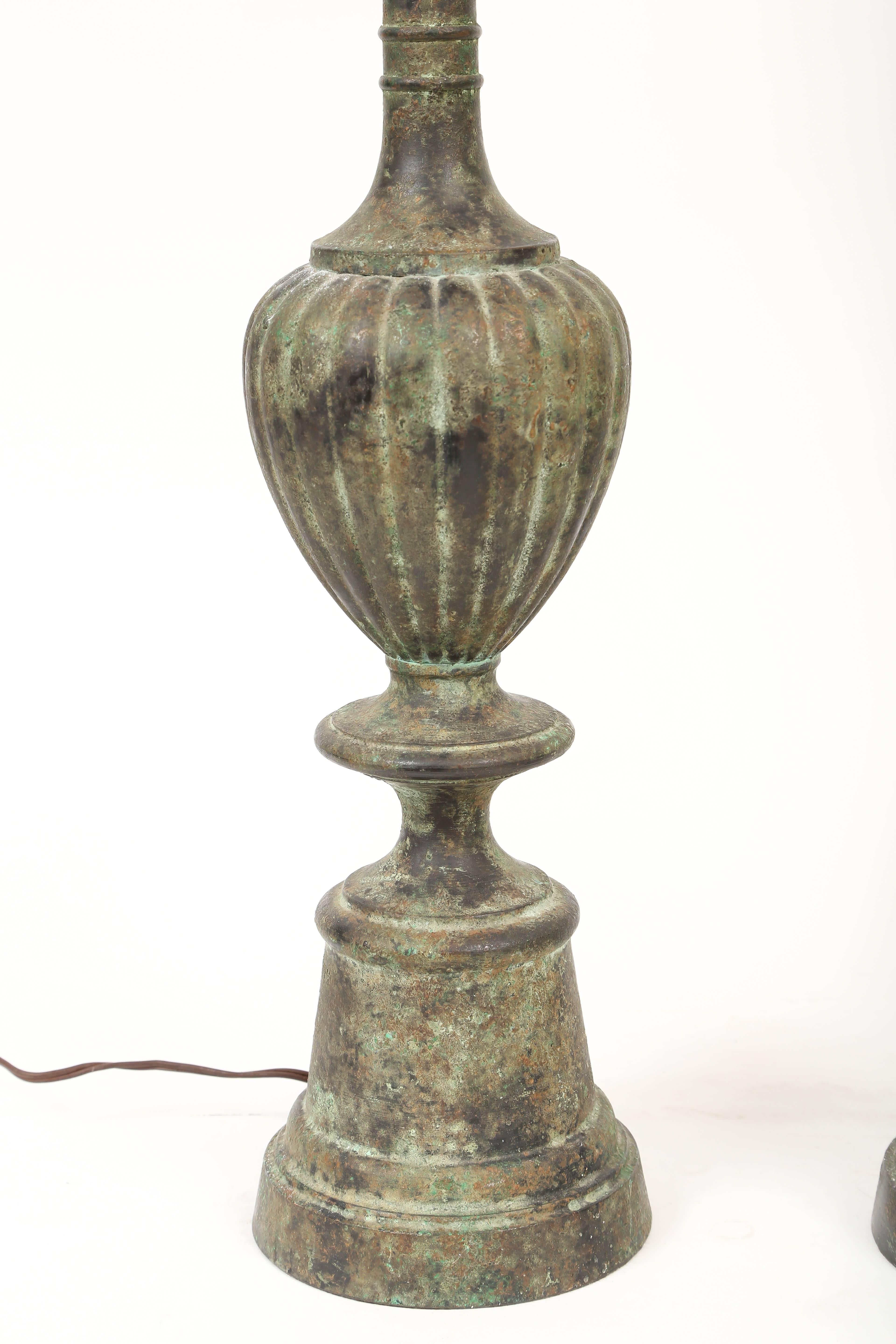 Highly decorative pair of Pompeii style verdigris bronze lamps. Heavy cast with complex pagination.