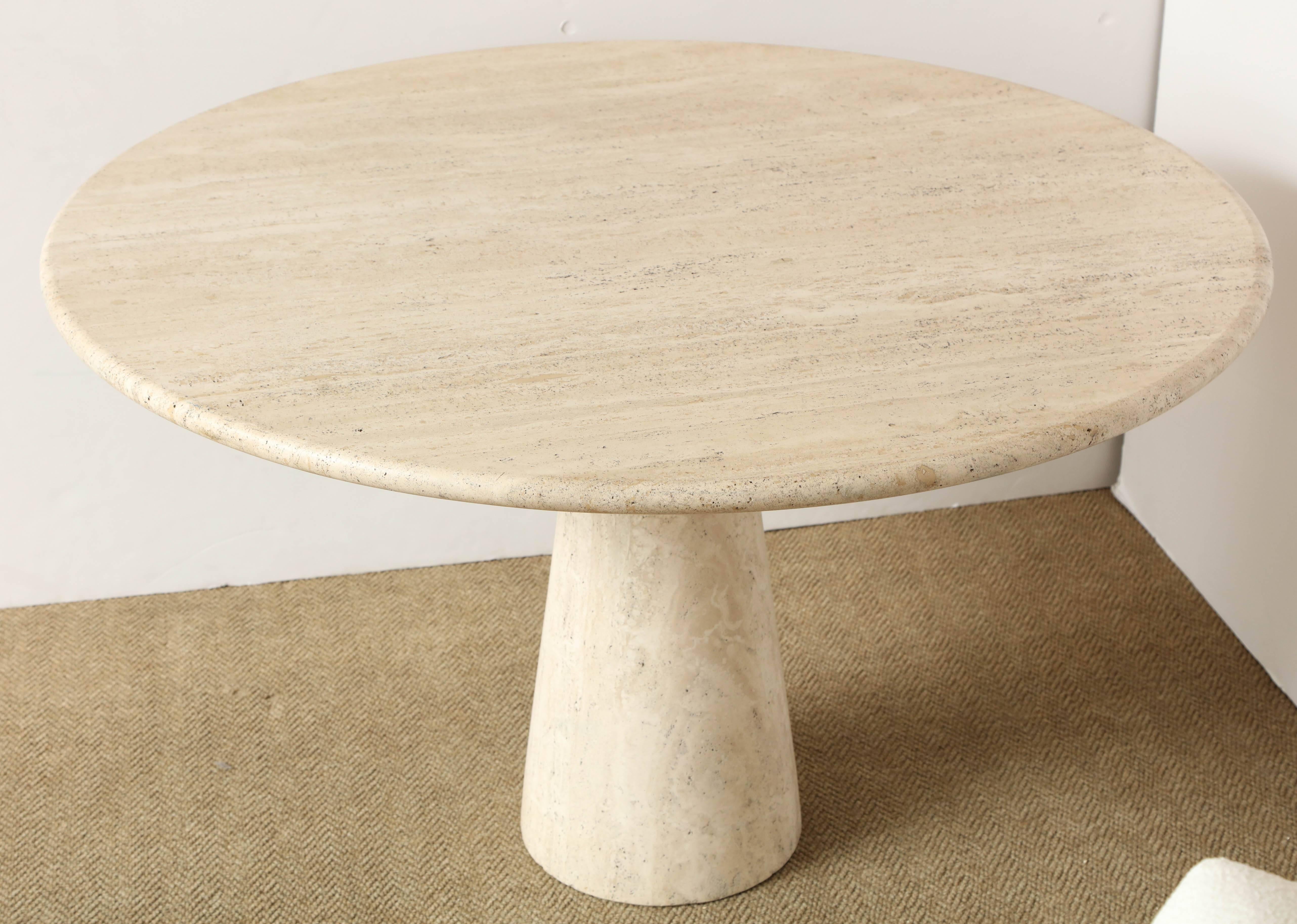 Sleek and large round dining table in the manner of Angelo Mangiarotti, Italy, circa 1970. This conical pedestal base and top table executed with solid travertine can accommodate 4/6 chairs or used as a gueridon/center table.
Table is in superb