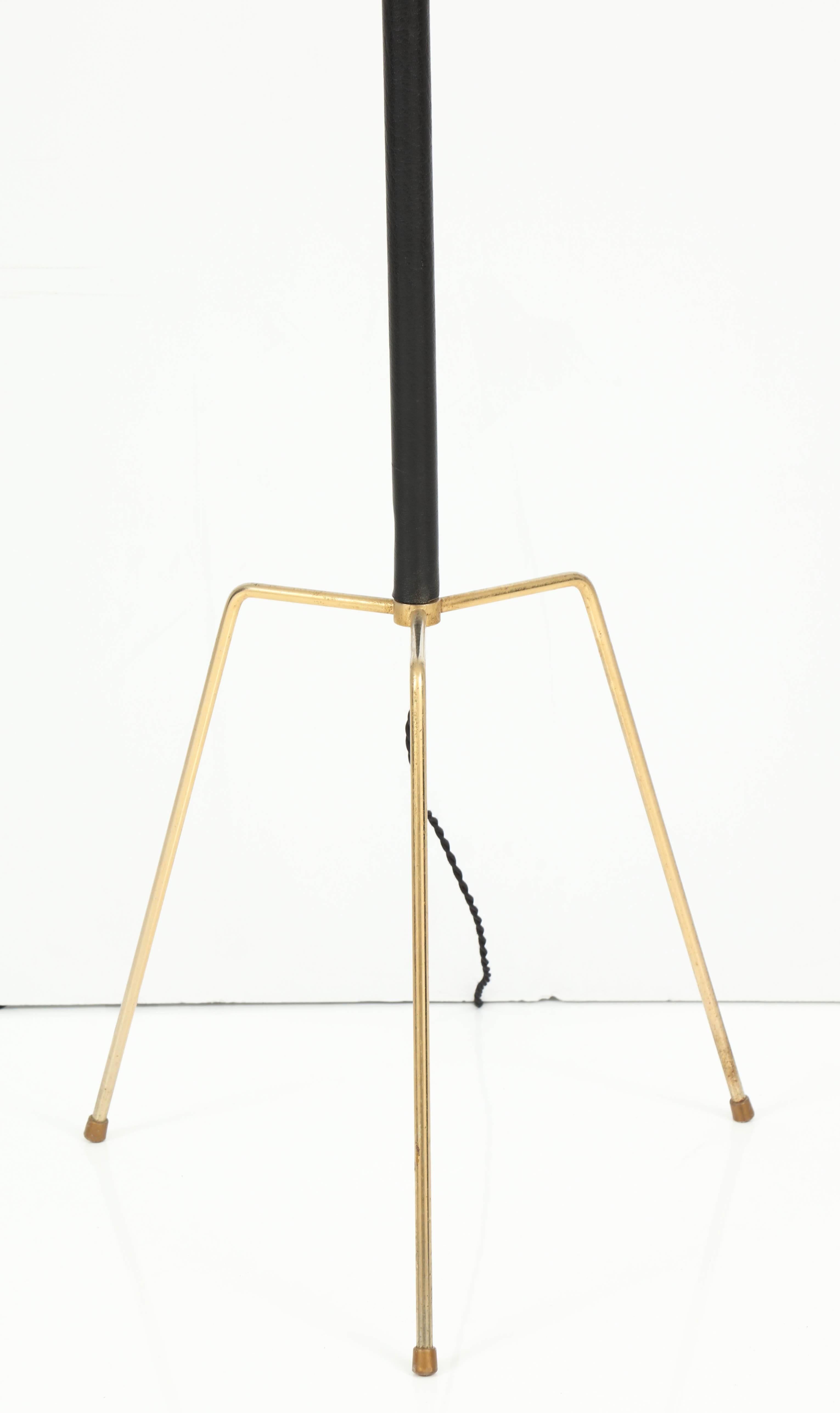 A leather stitched over brass floor lamp by Jacques Adnet, all vintage with new shade and wiring.